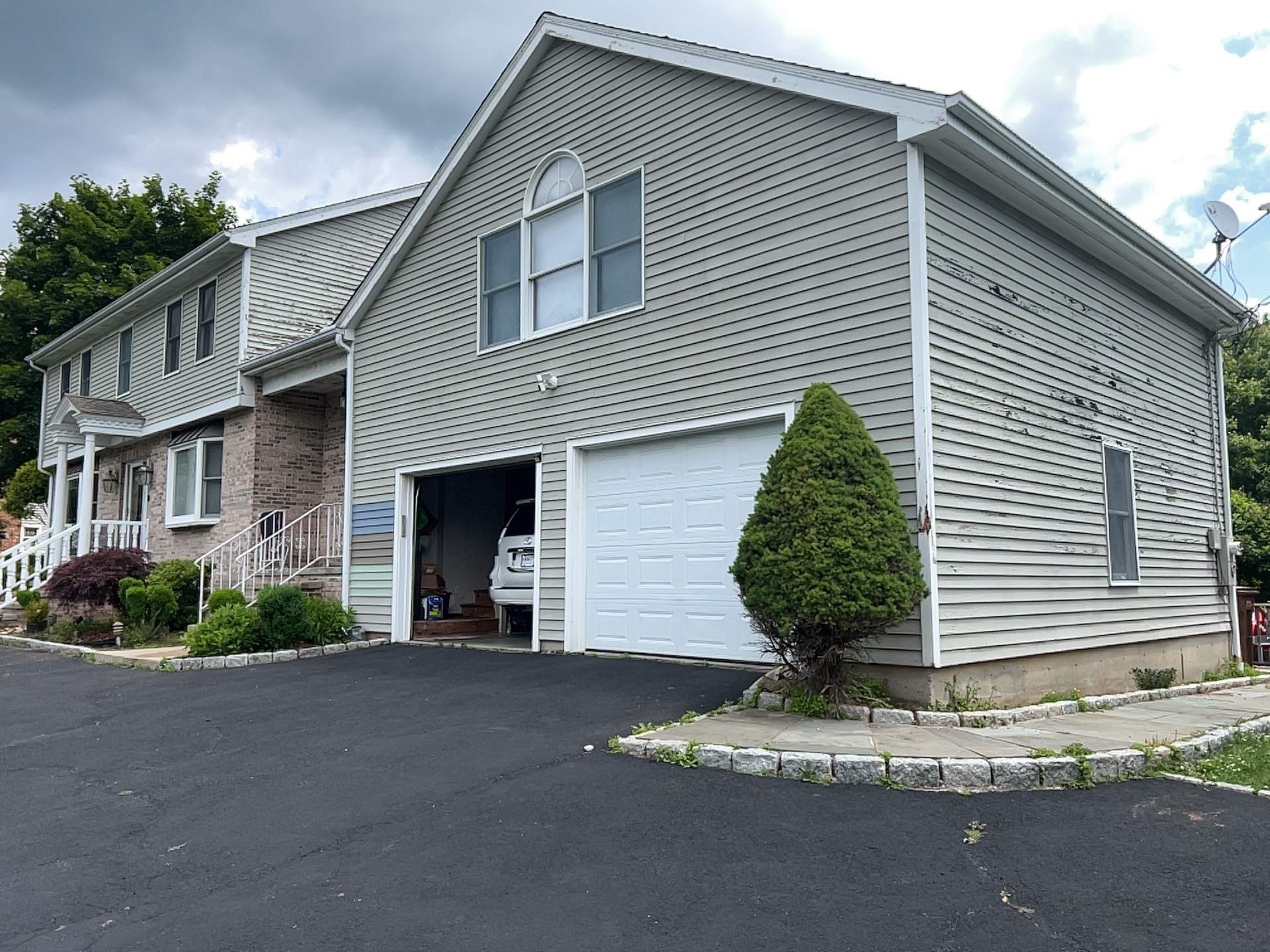 Siding Installation using Mainstreet Colonial & White gutters by A Plus Exterior