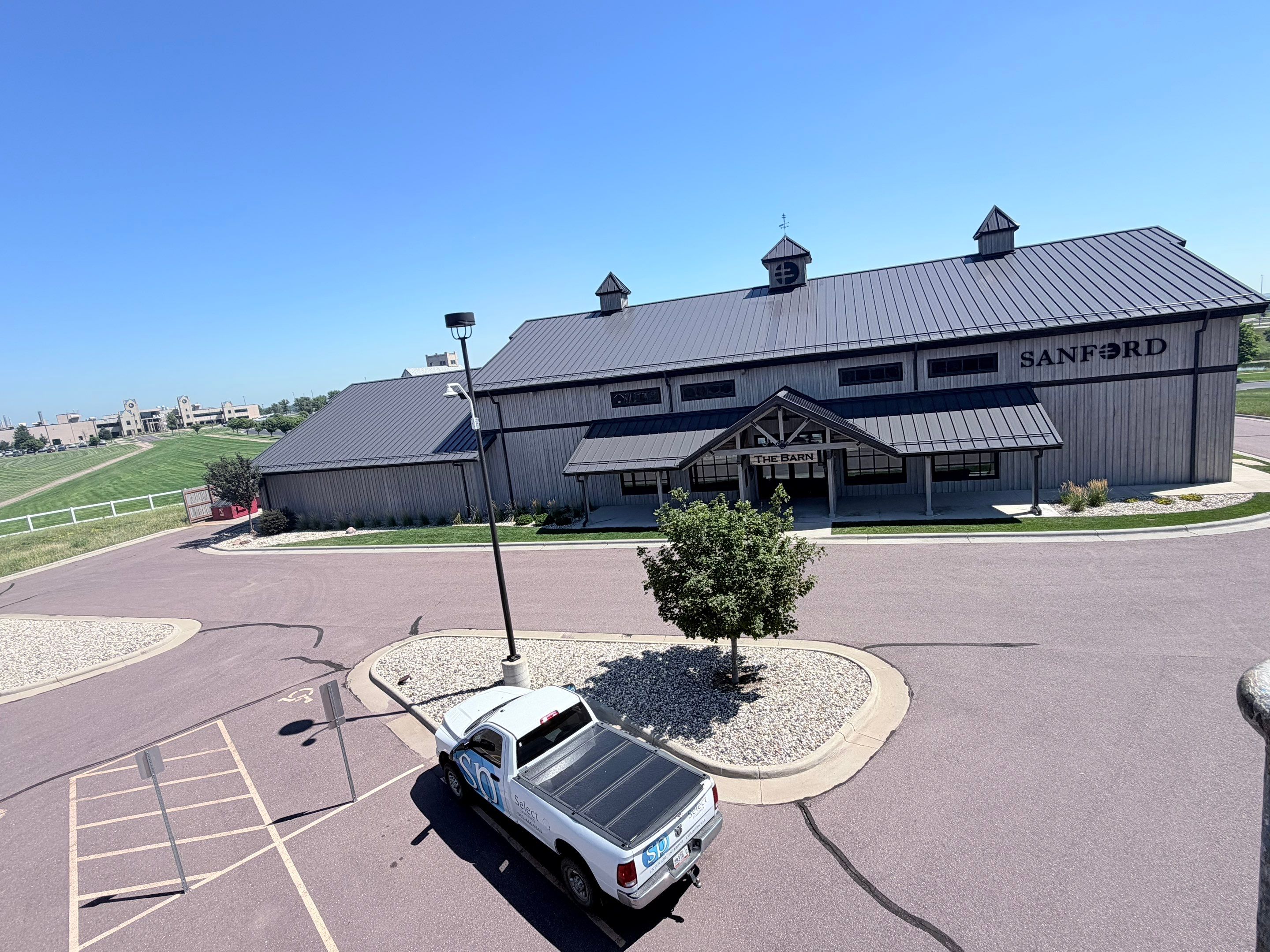 Commercial Exterior Wood Staining for Sanford Barn in Sioux Falls by Select Painting, Coatings & Garage Cabinets
