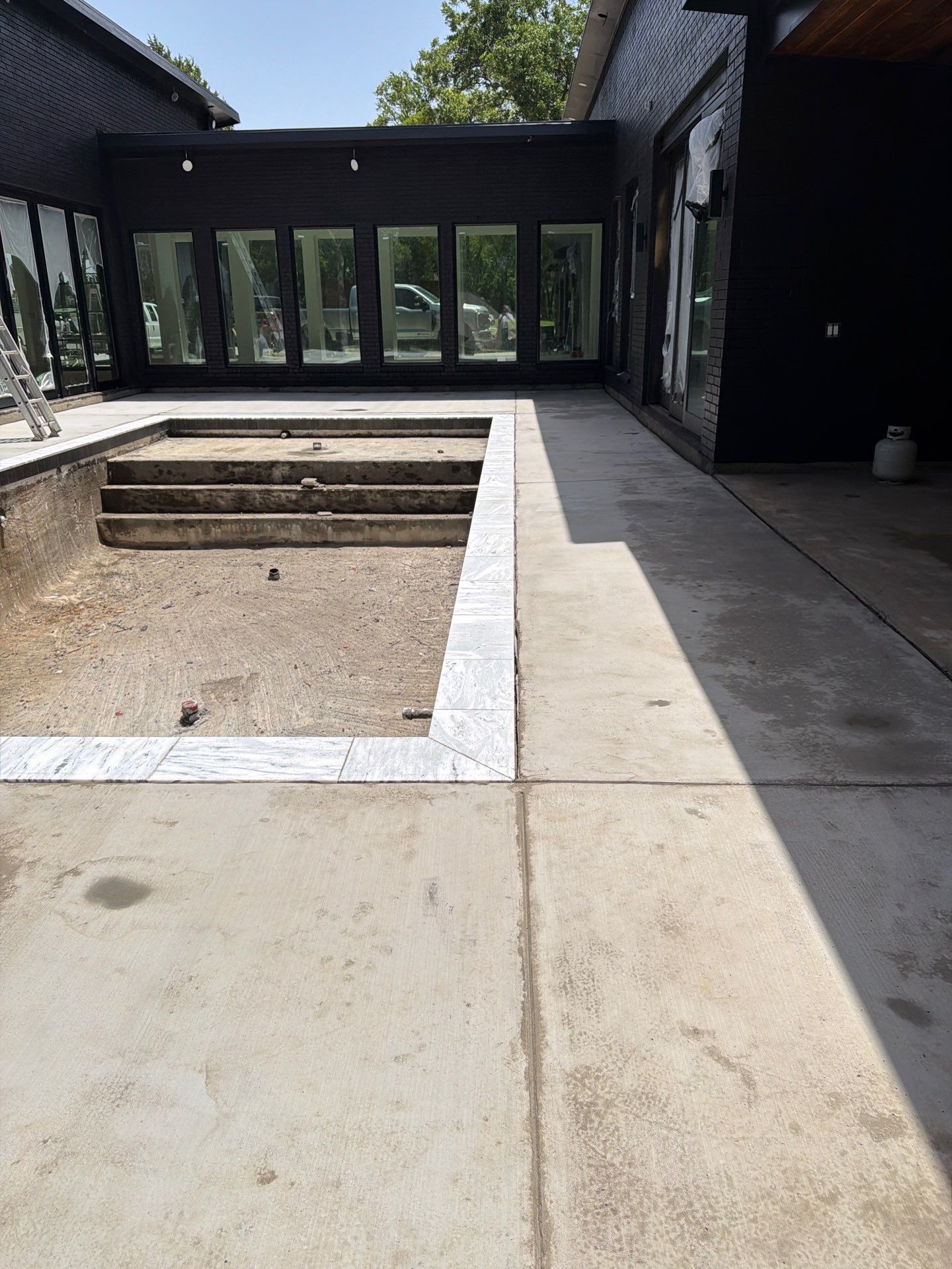 Modern Geometric Pool with Tanning Ledge by Pinnacle Pools and Spas - DFW