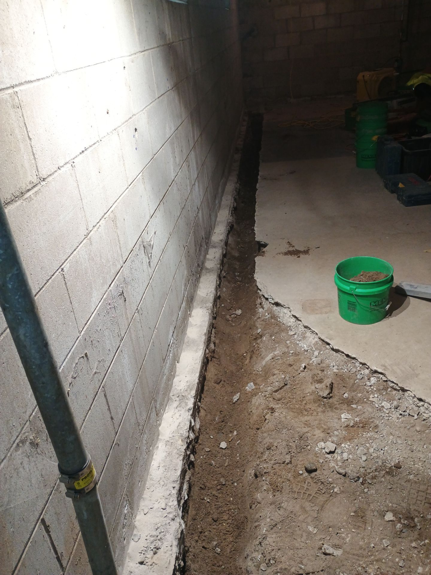 Interior Drain Tile & Buried Discharge in South Minneapolis by Waterproofing Northeast