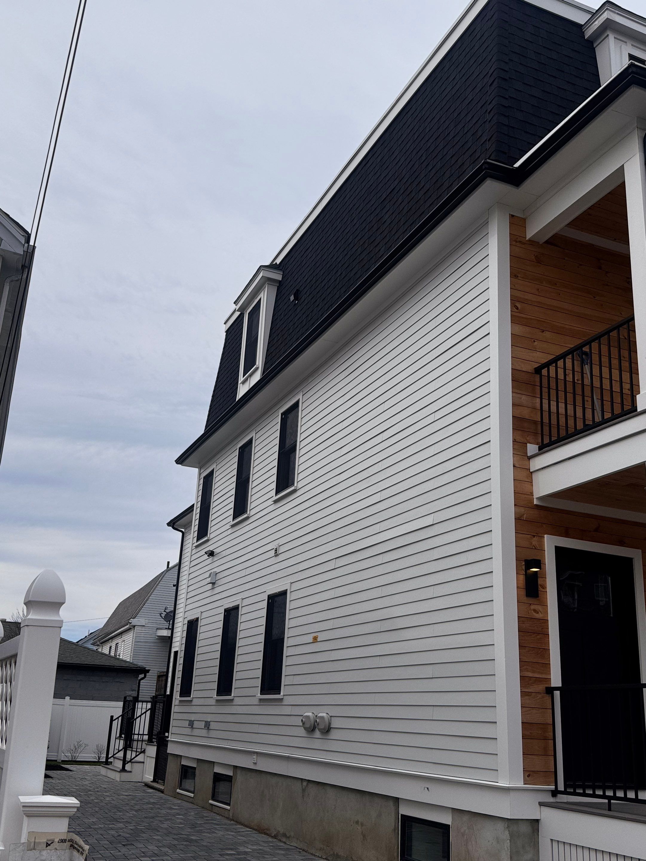 Black Gutter Installation by JOHNNYS PRO