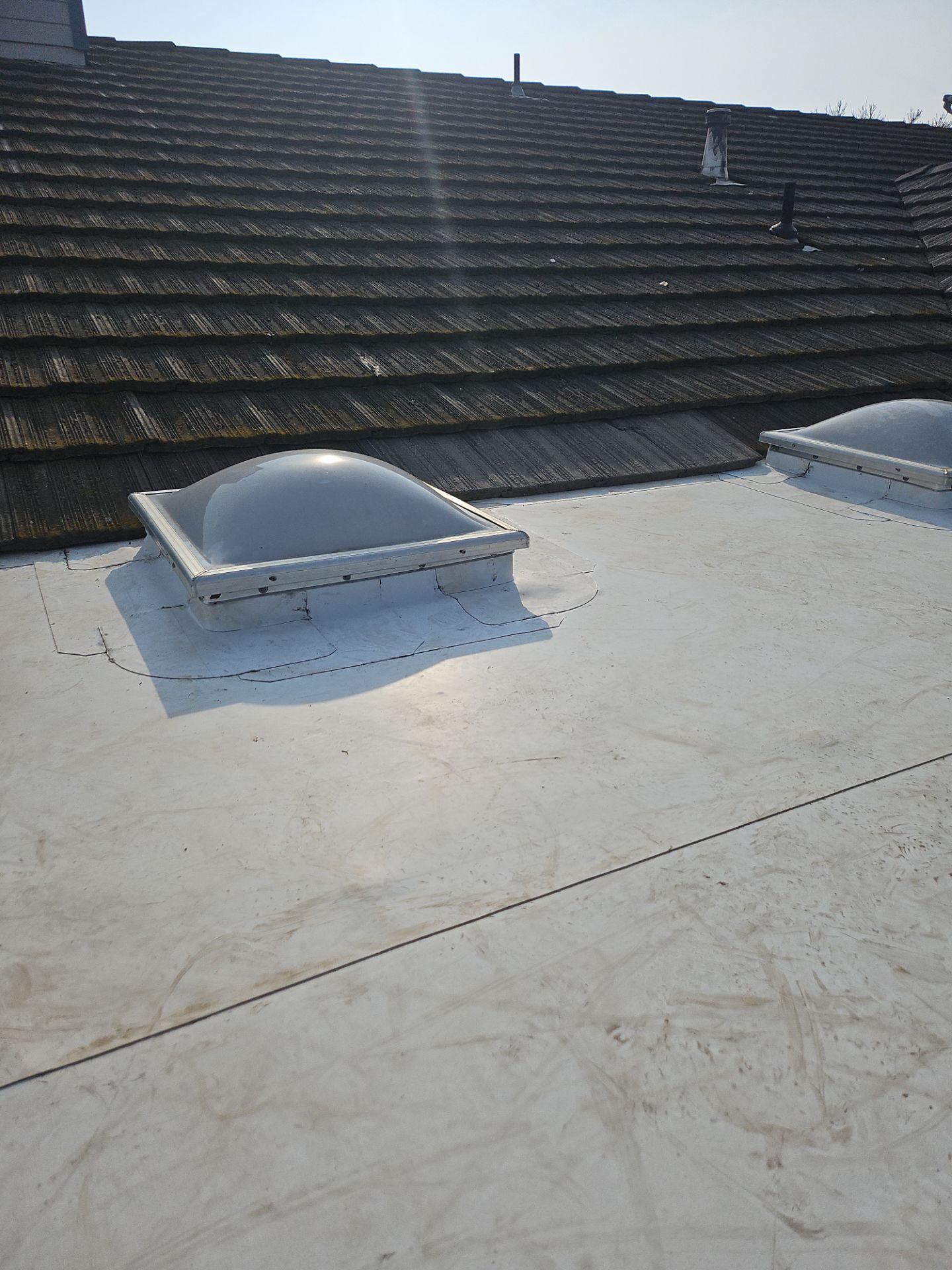 Single-ply roofing system on porch using TPO 60 mil by Straight Edge Roofing Inc