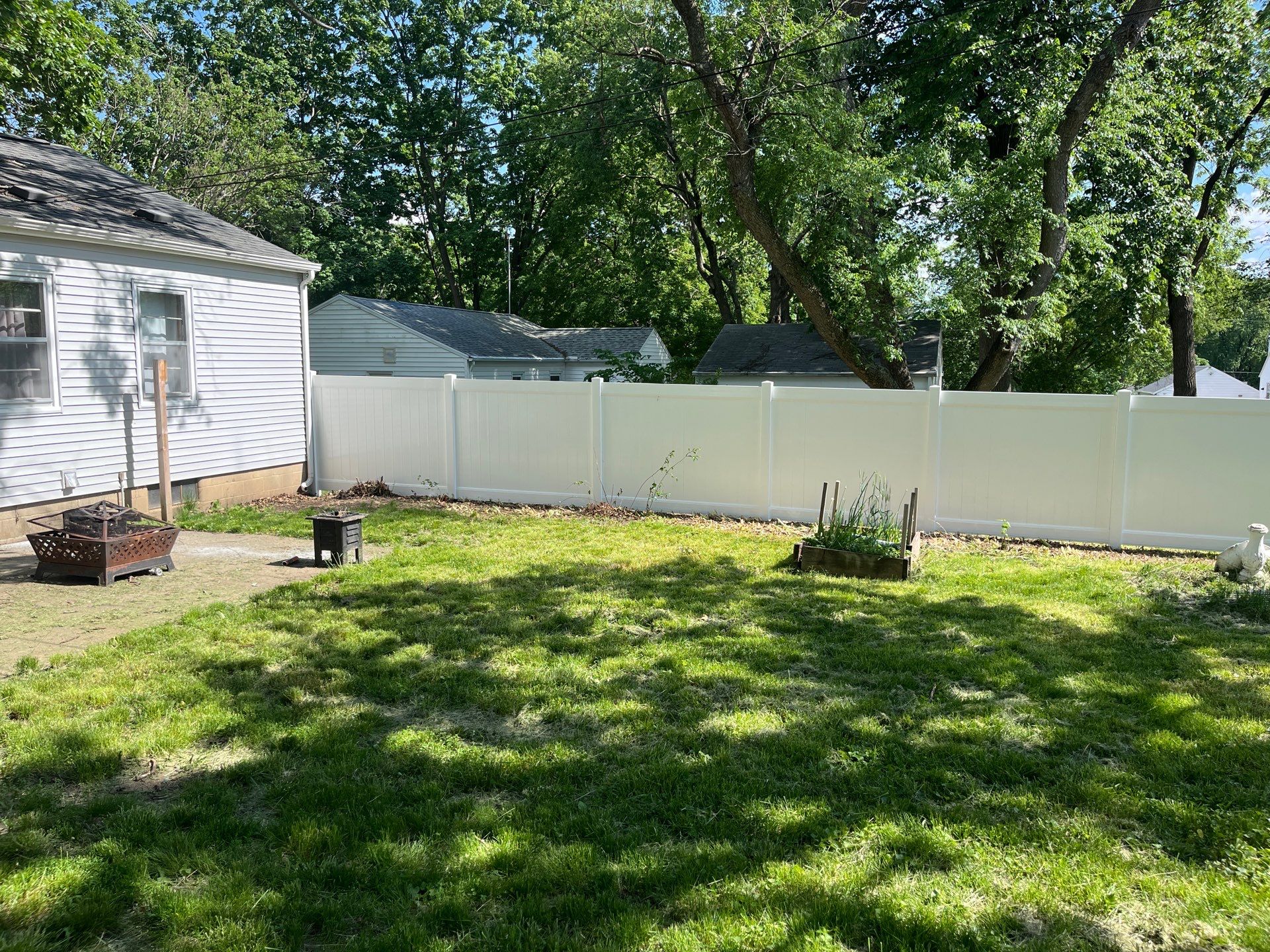 White Vinyl Privacy Fence and Double Gate Installation in Cedar Falls by Perfect Picket Fence and Stain