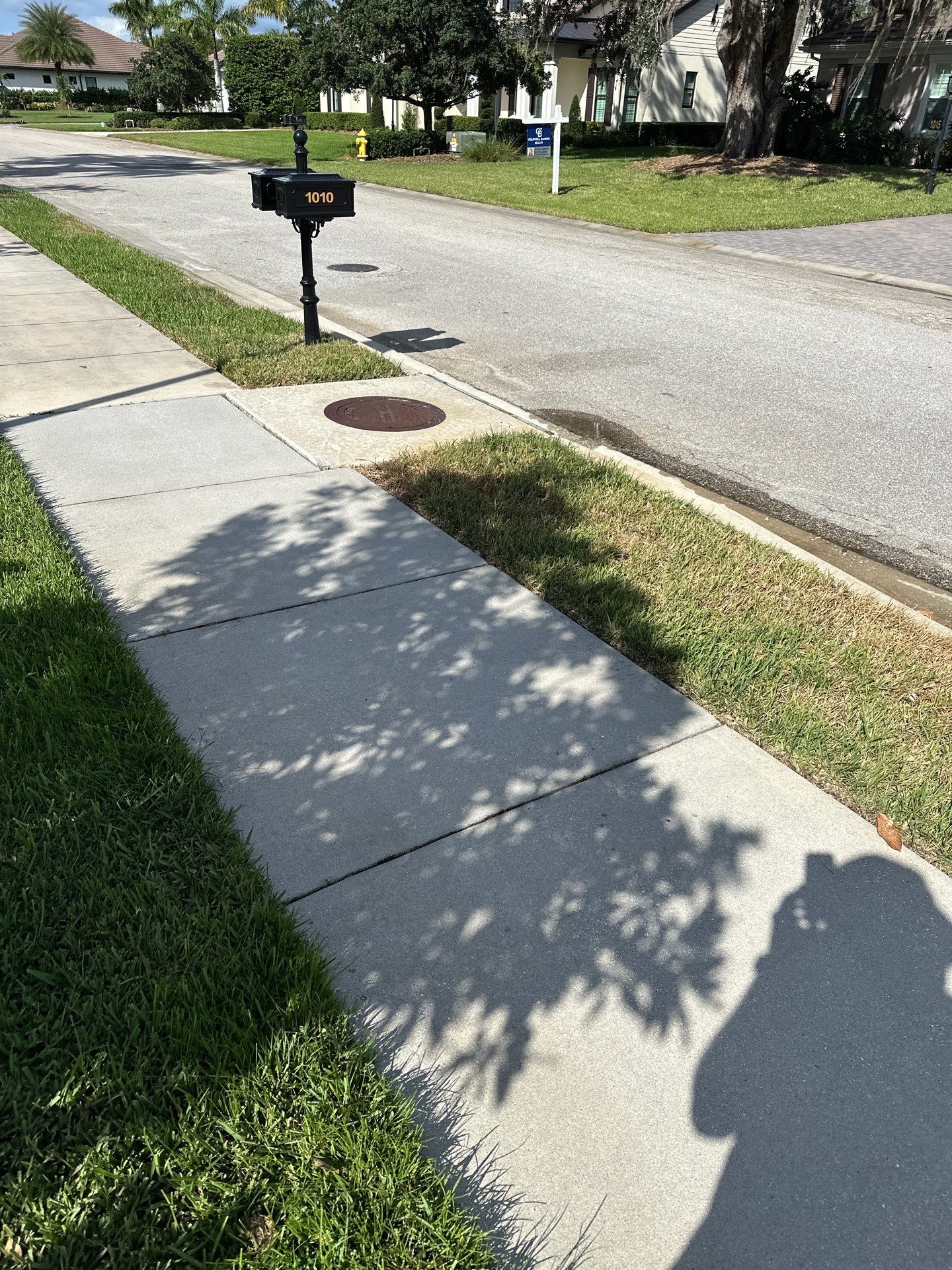 Paver Driveway, Entryway, Sidewalk, and Street Curbing Cleaning in Winding River Community, Bradenton, FL by Sunshine AquaWash