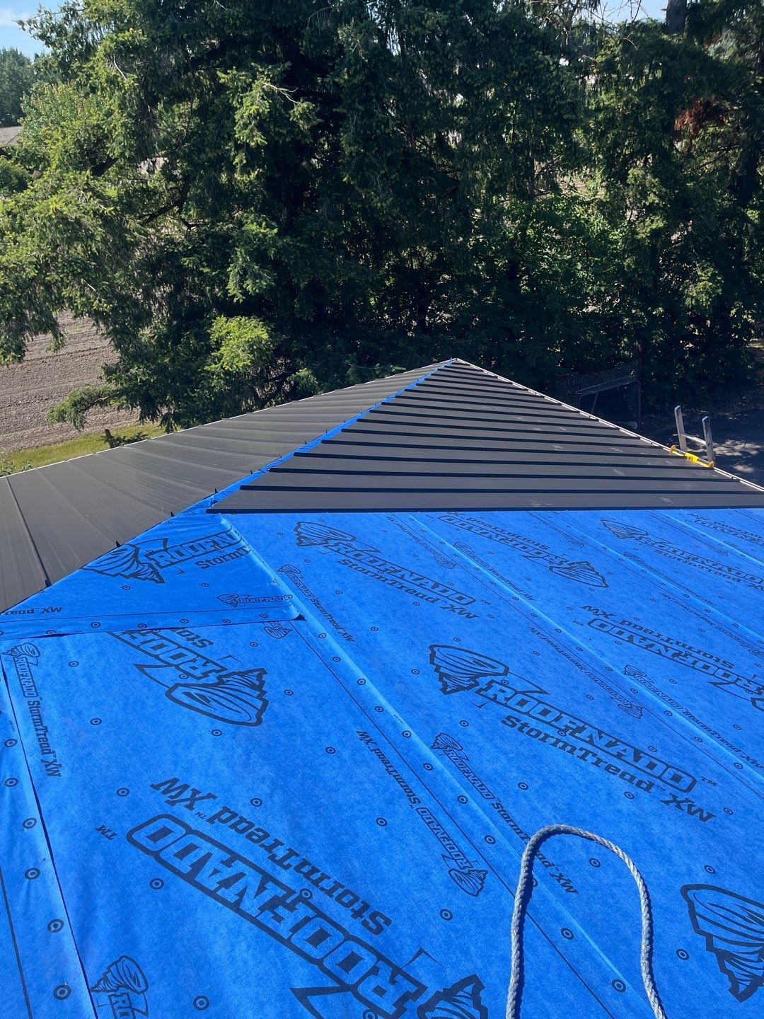 Residential Roofing Installation using 12" Prolok metal  by Top Notch Roofing Inc