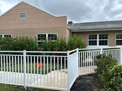 Aluminum Fence Installation using White 3 Rail Aluminum Fence 