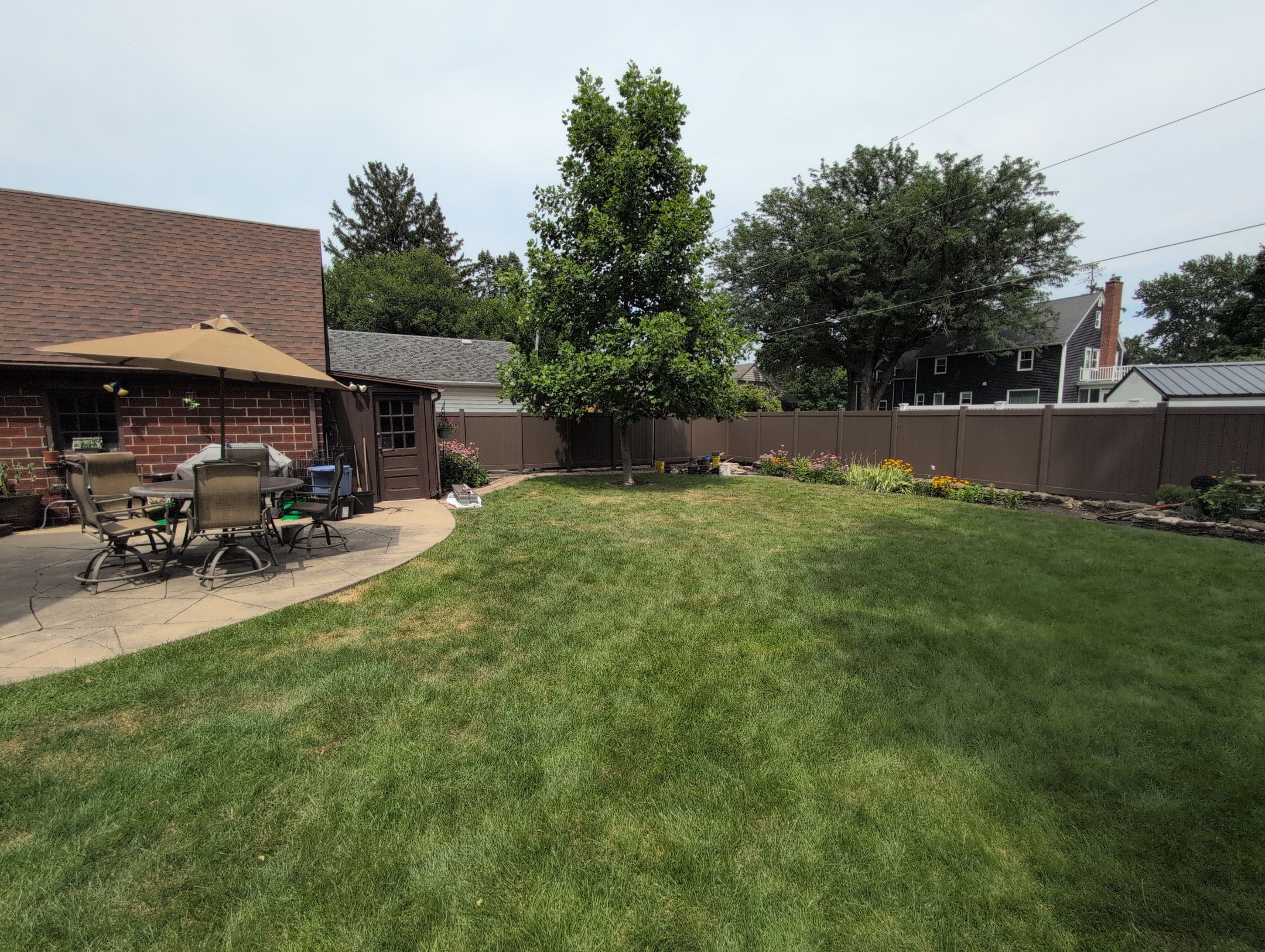Walnut Vinyl Privacy Fence Installation in Waterloo by Perfect Picket Fence and Stain