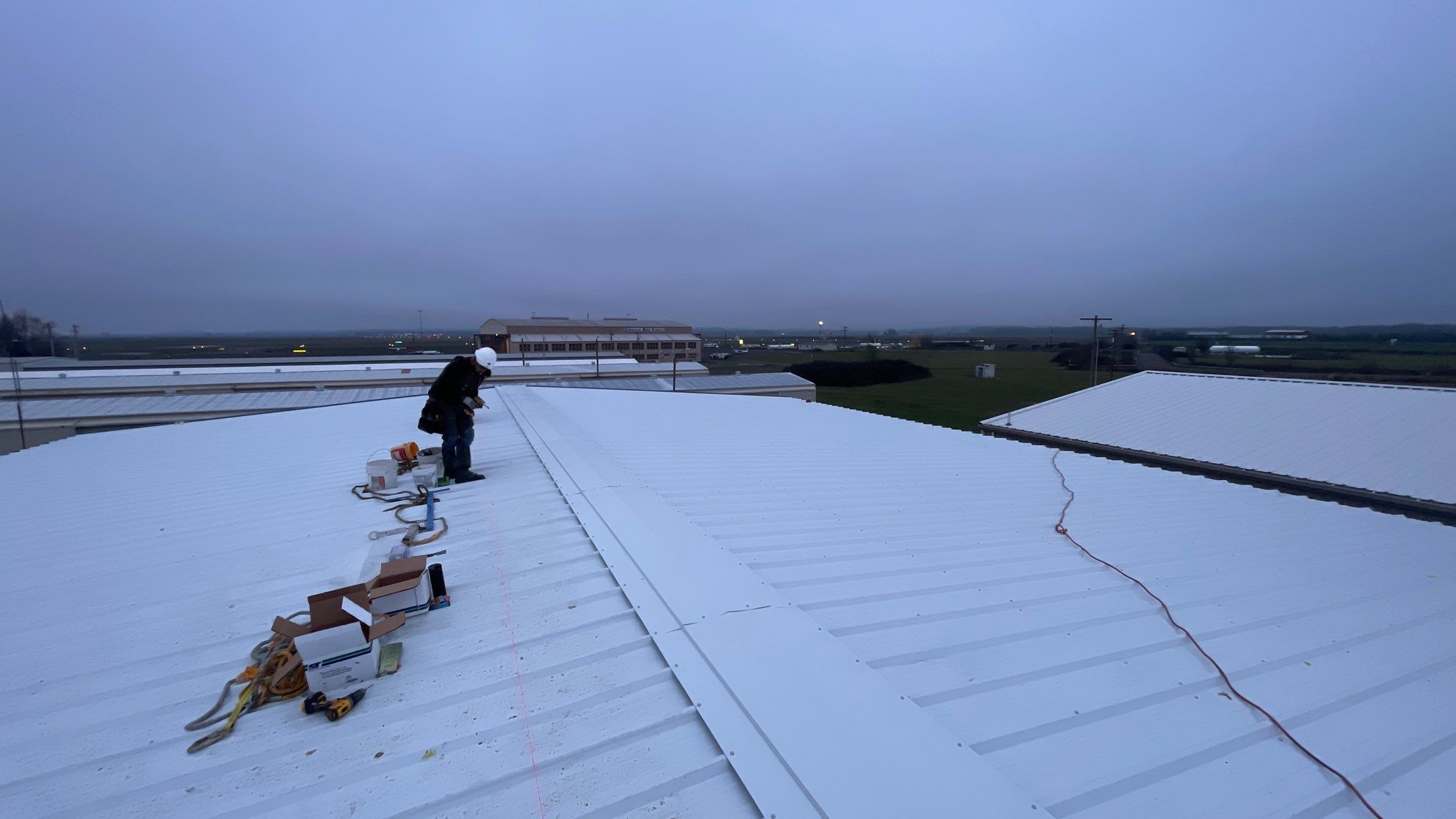 Airport Hanger Metal Roof Replacement and Insulation by Villegas Remodeling, LLC