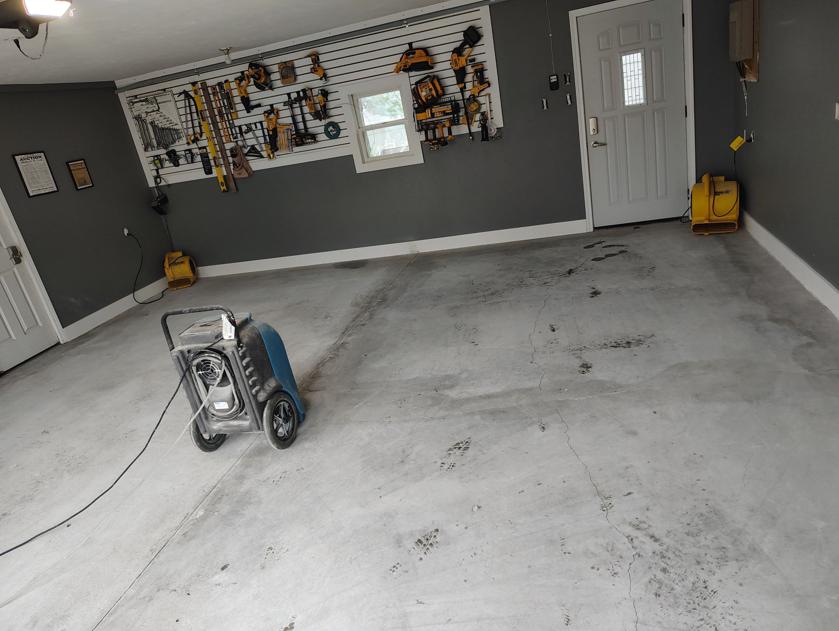 Custom Garage Floor Coating and Backyard Patio Refinishing in Tyndall by Select Painting, Coatings & Garage Cabinets