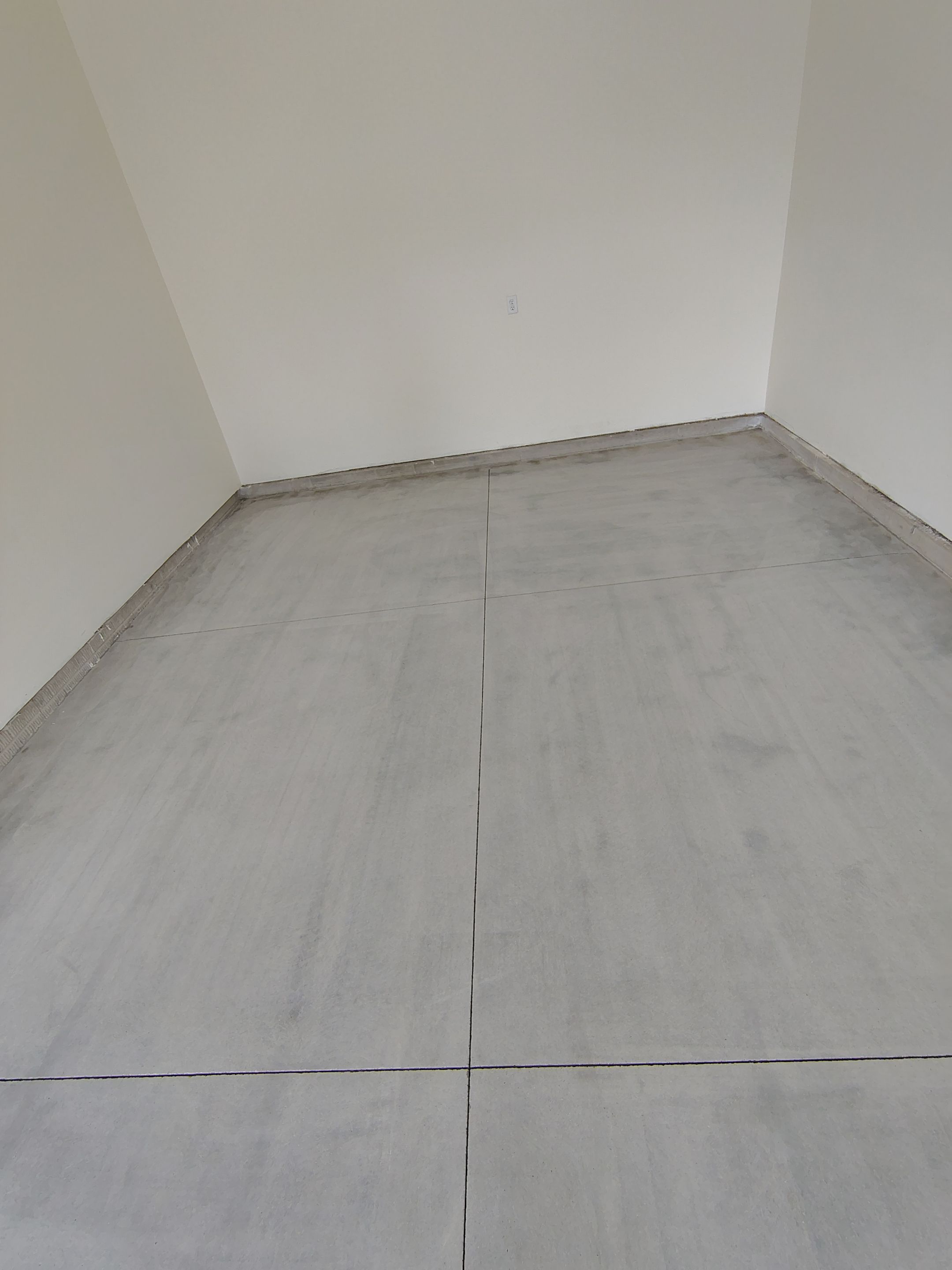 Sioux Falls Garage Floor Transformation with Gray Decorative Flake Coating by Select Painting, Coatings & Garage Cabinets