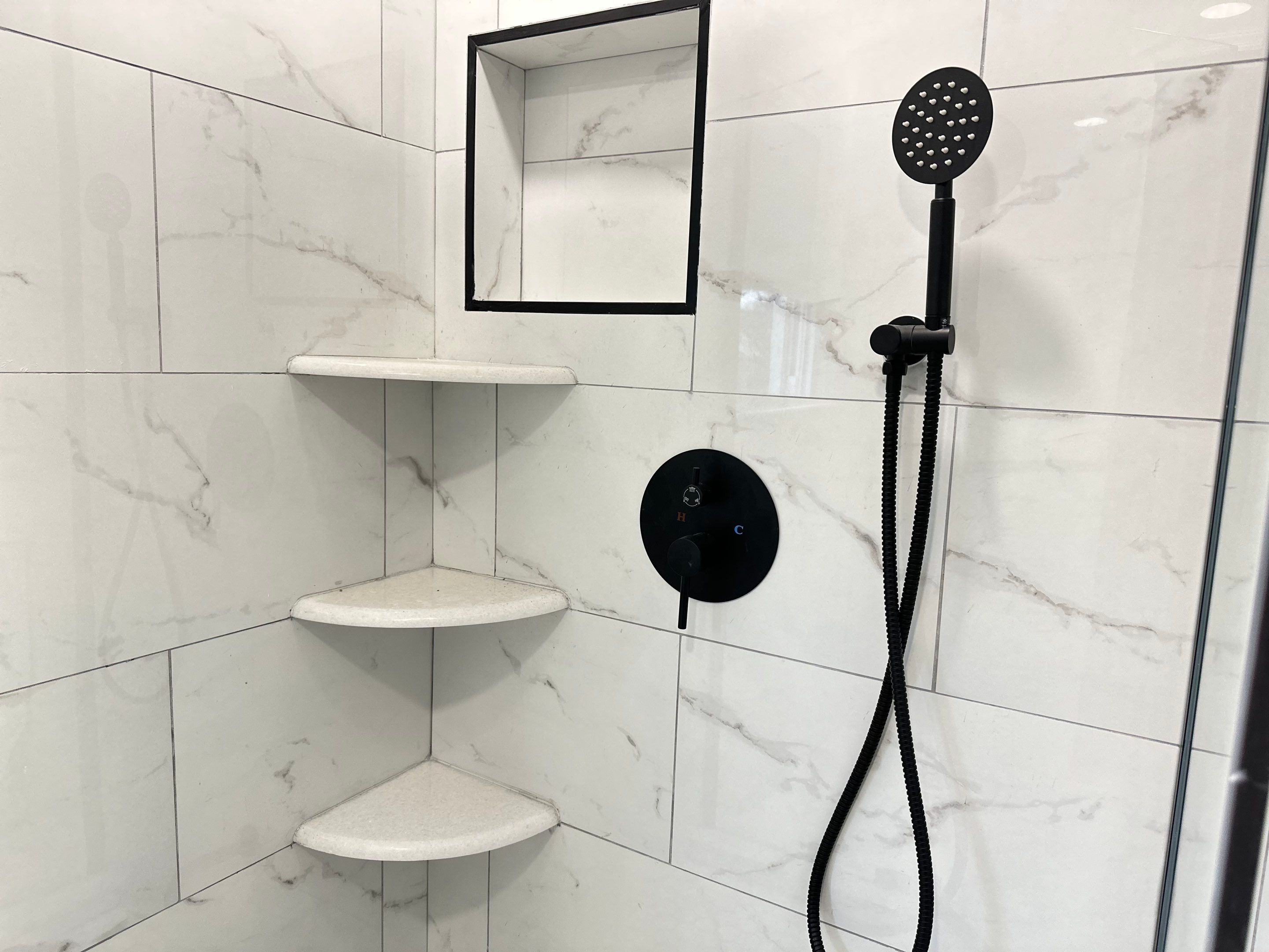 Bathroom Remodel using Tile by Home Concepts Construction