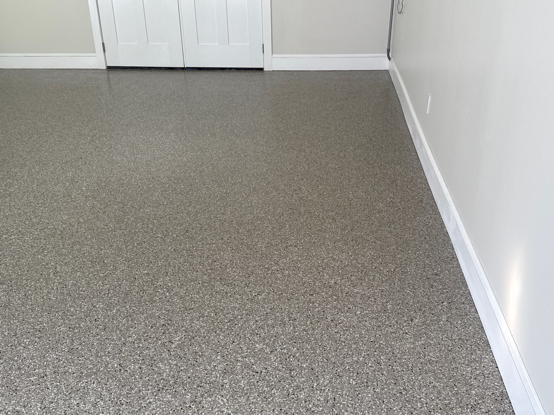 Garage and Sidewalk Project in Keystone Heights, FL in Pebble Beach by Cross Creek Concrete Coatings