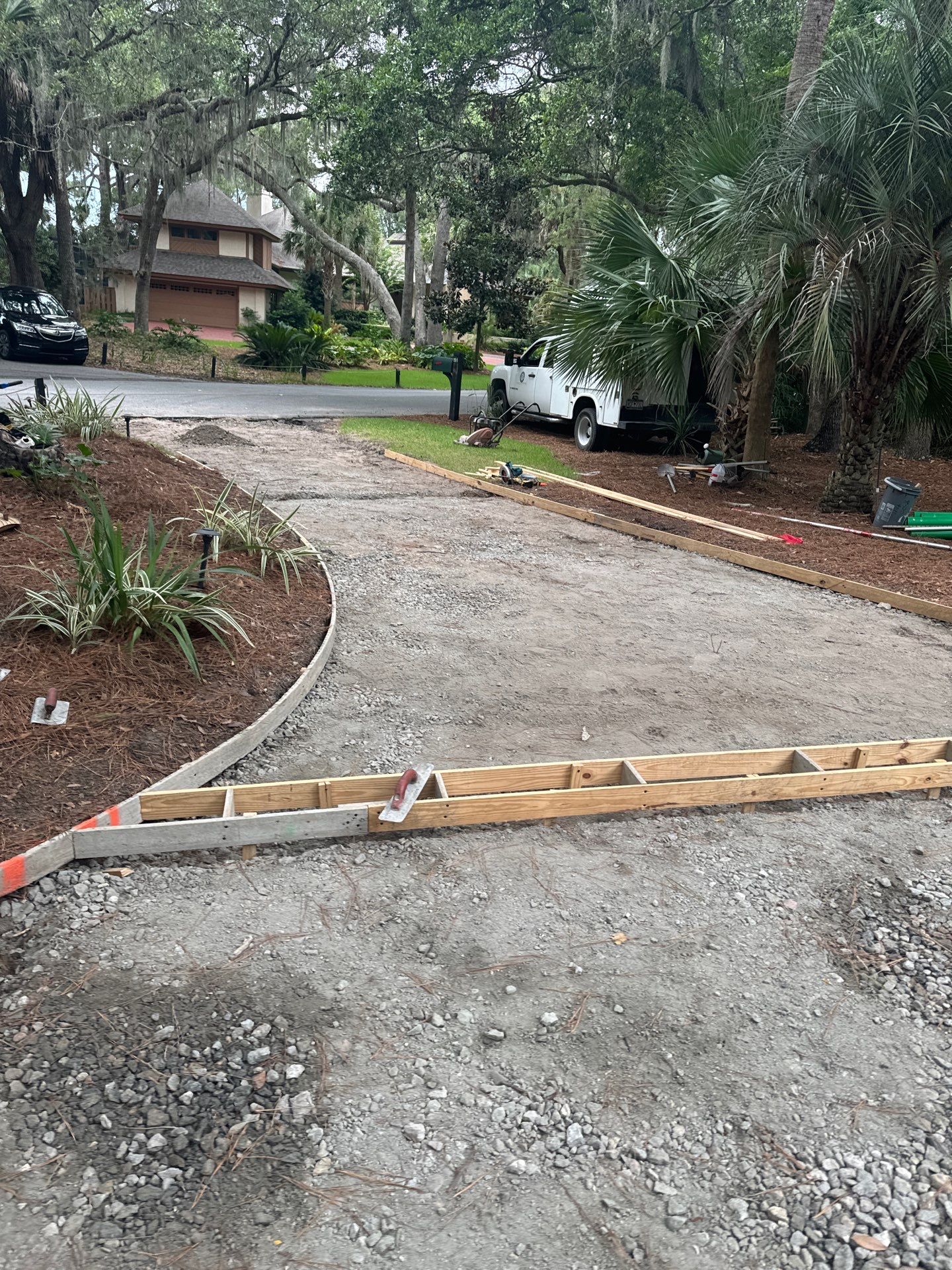 Hilton Head Island Concrete Driveway Replacement with Decorative Paver Borders by Lowcountry Scapes, LLC