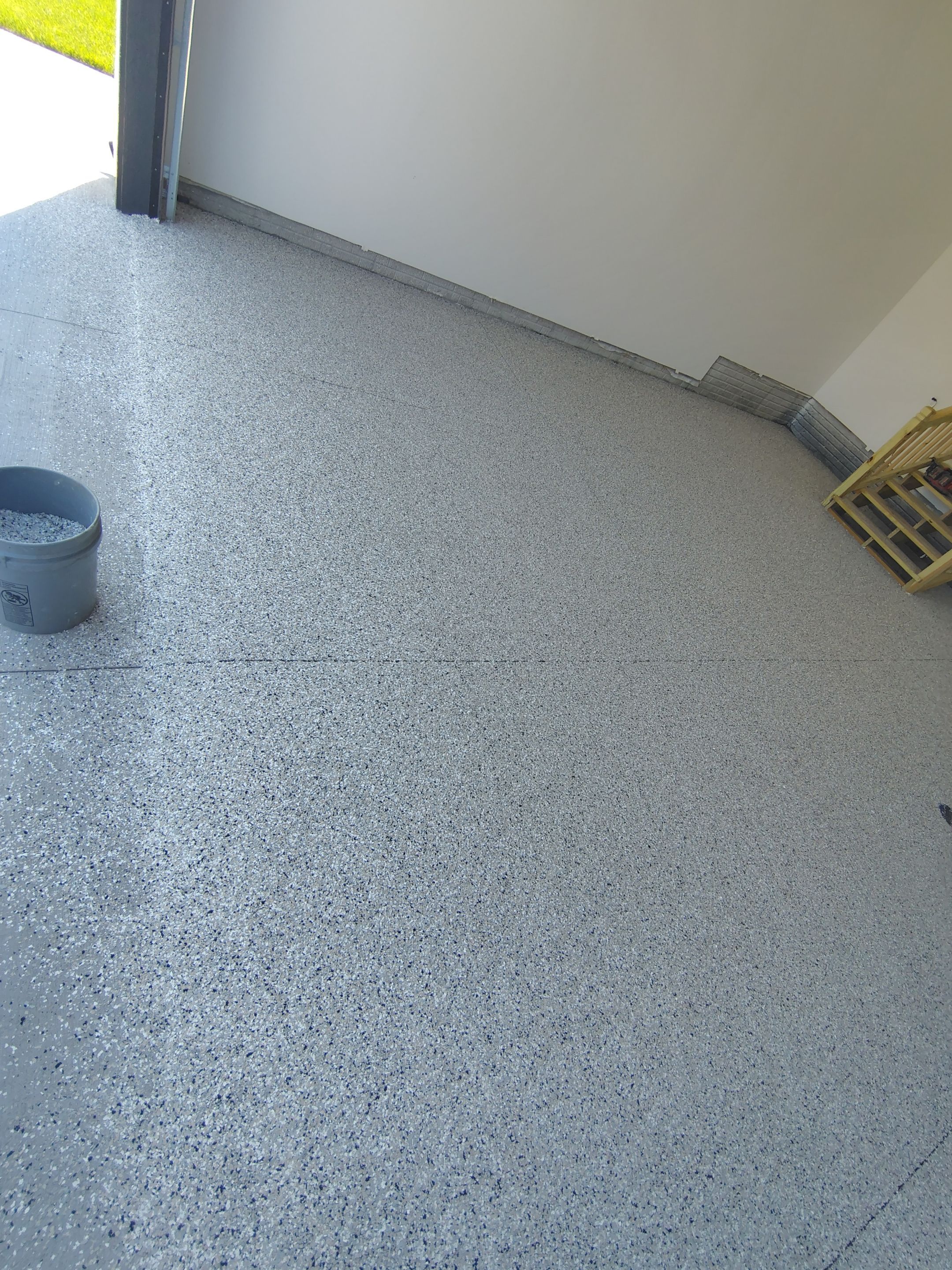 Cabin Fever Decorative Flake Garage Floor Coating in Sioux Falls by Select Painting, Coatings & Garage Cabinets