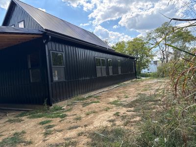 Black gutters on black building