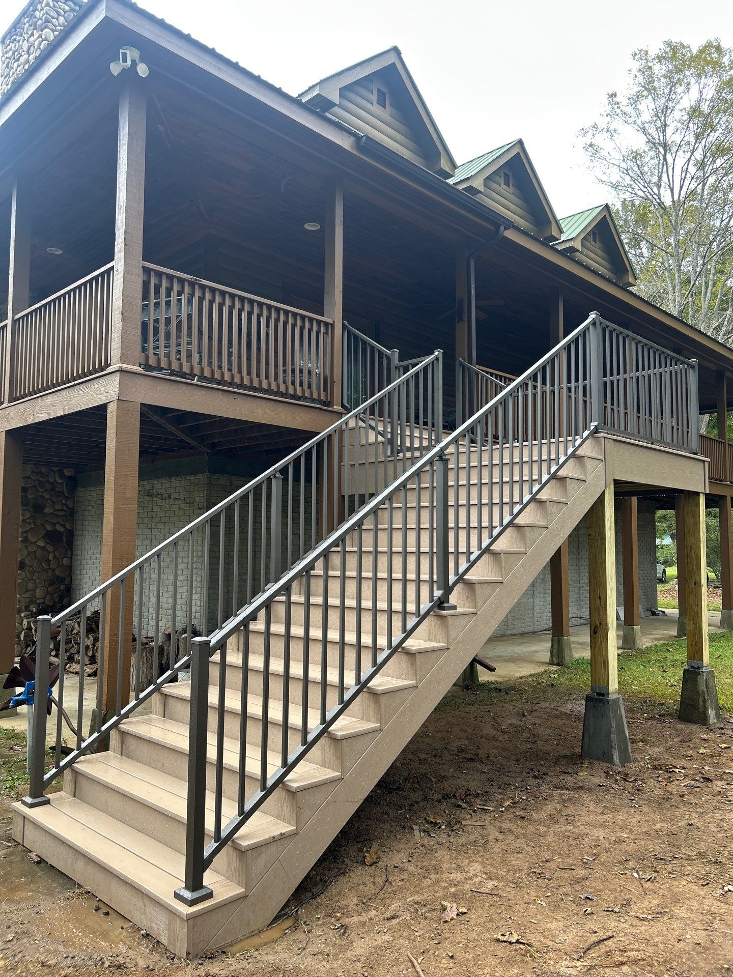 Log Cabin Wrap-Around Deck and External Staircase Installation in Caldwell by Walnut Hollow Decks & Outdoor Living