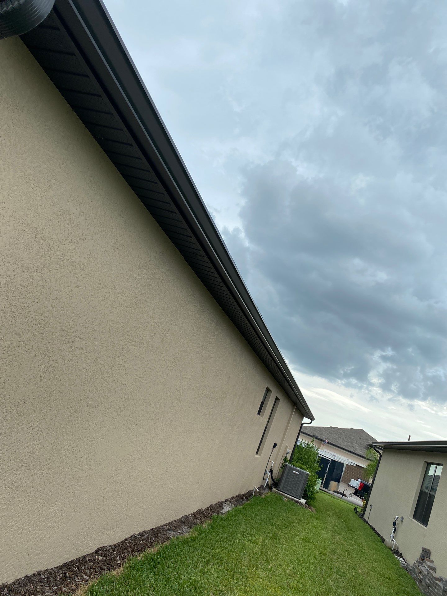 Brown Seamless Gutters for Homes in Fort Myers by Gutter Professors
