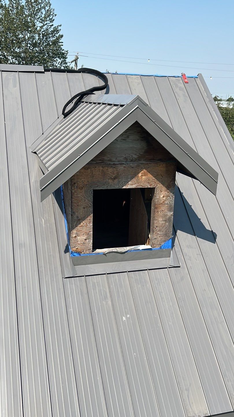 Agricultural Roofing Installation using 12" Prolok metal  by Top Notch Roofing Inc