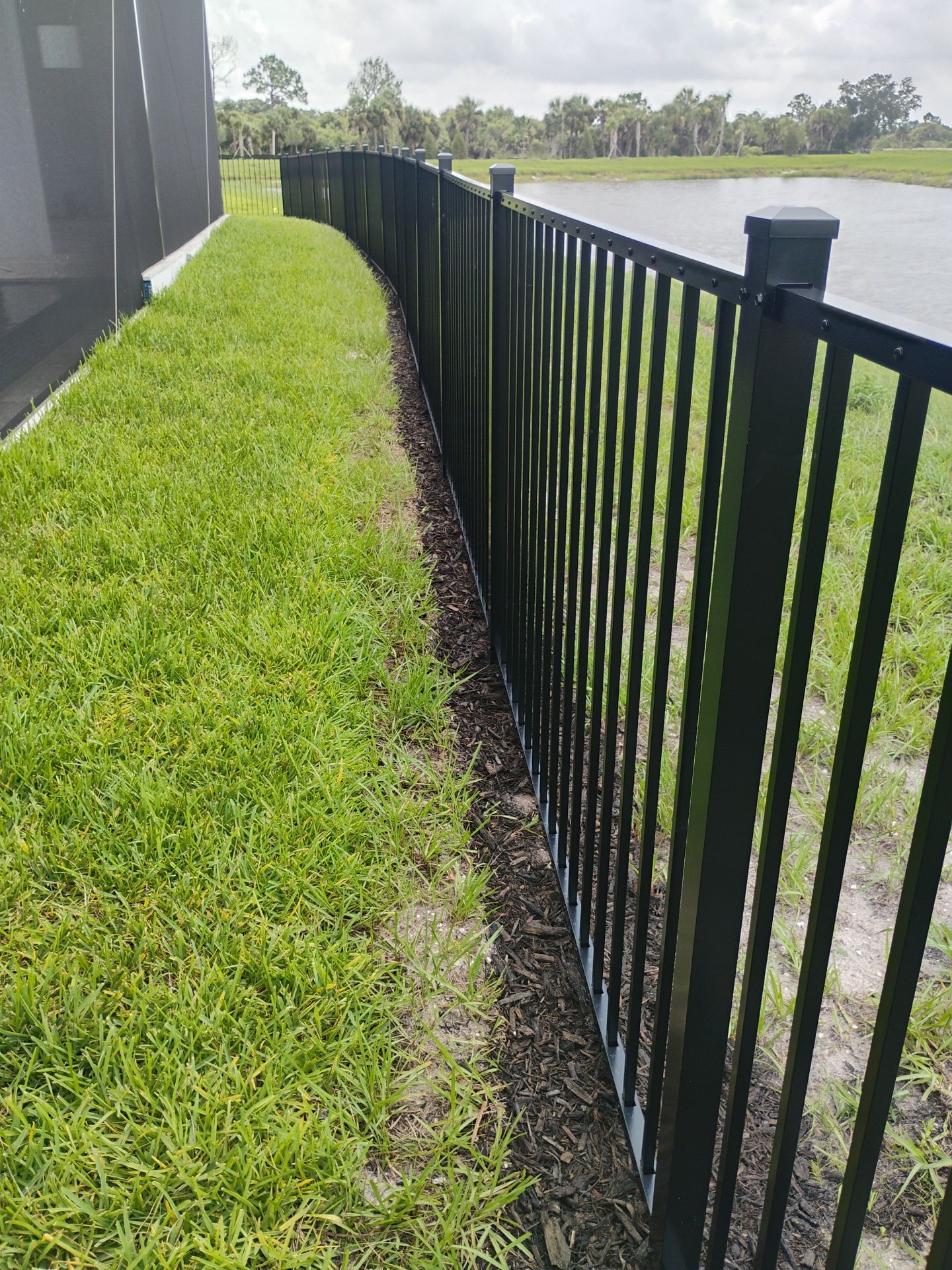 Black Aluminum Picket Fence Installation in Venice, Florida by True Fence LLC