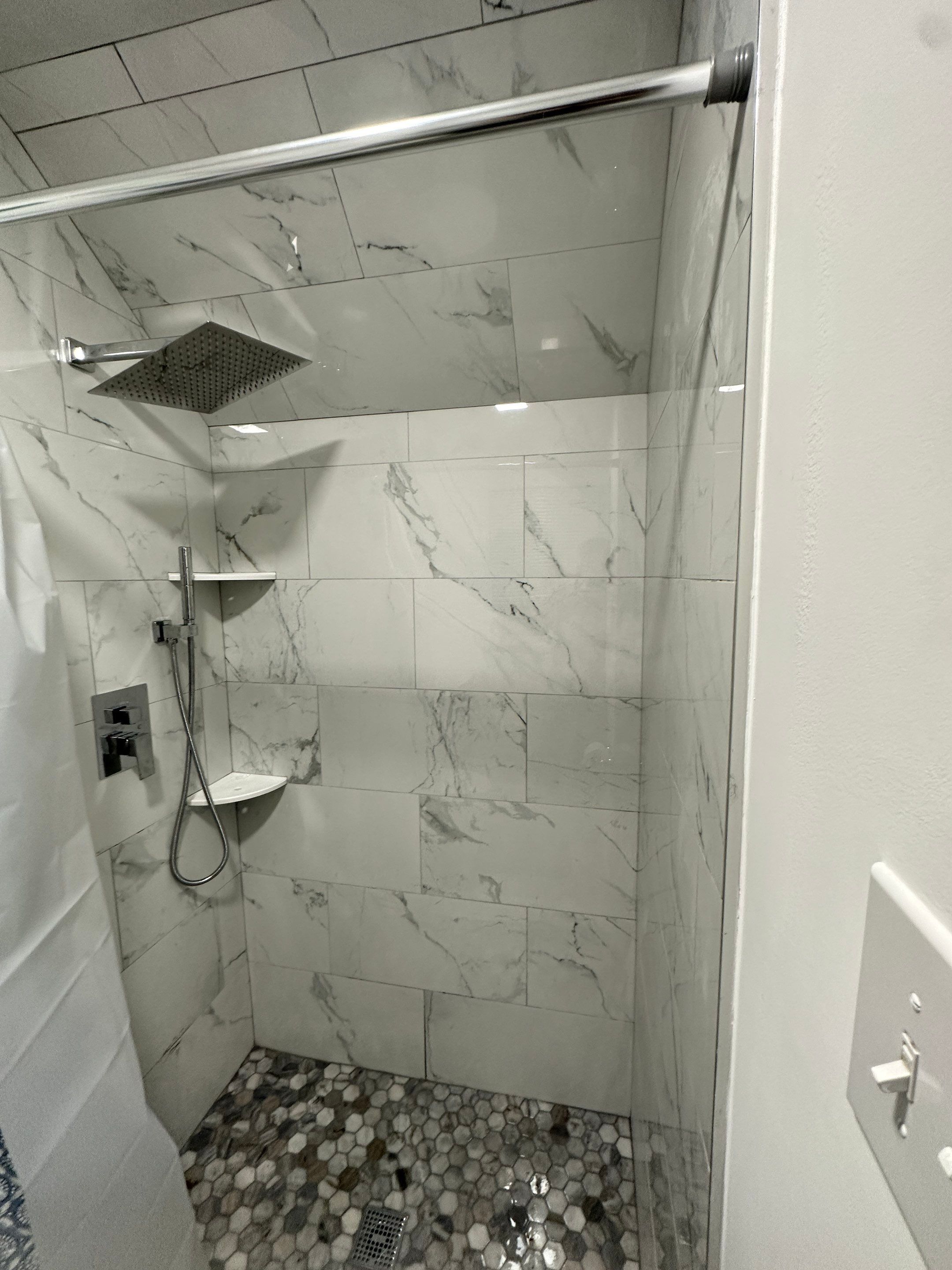 Bathroom Remodel using Tile by Home Concepts Construction