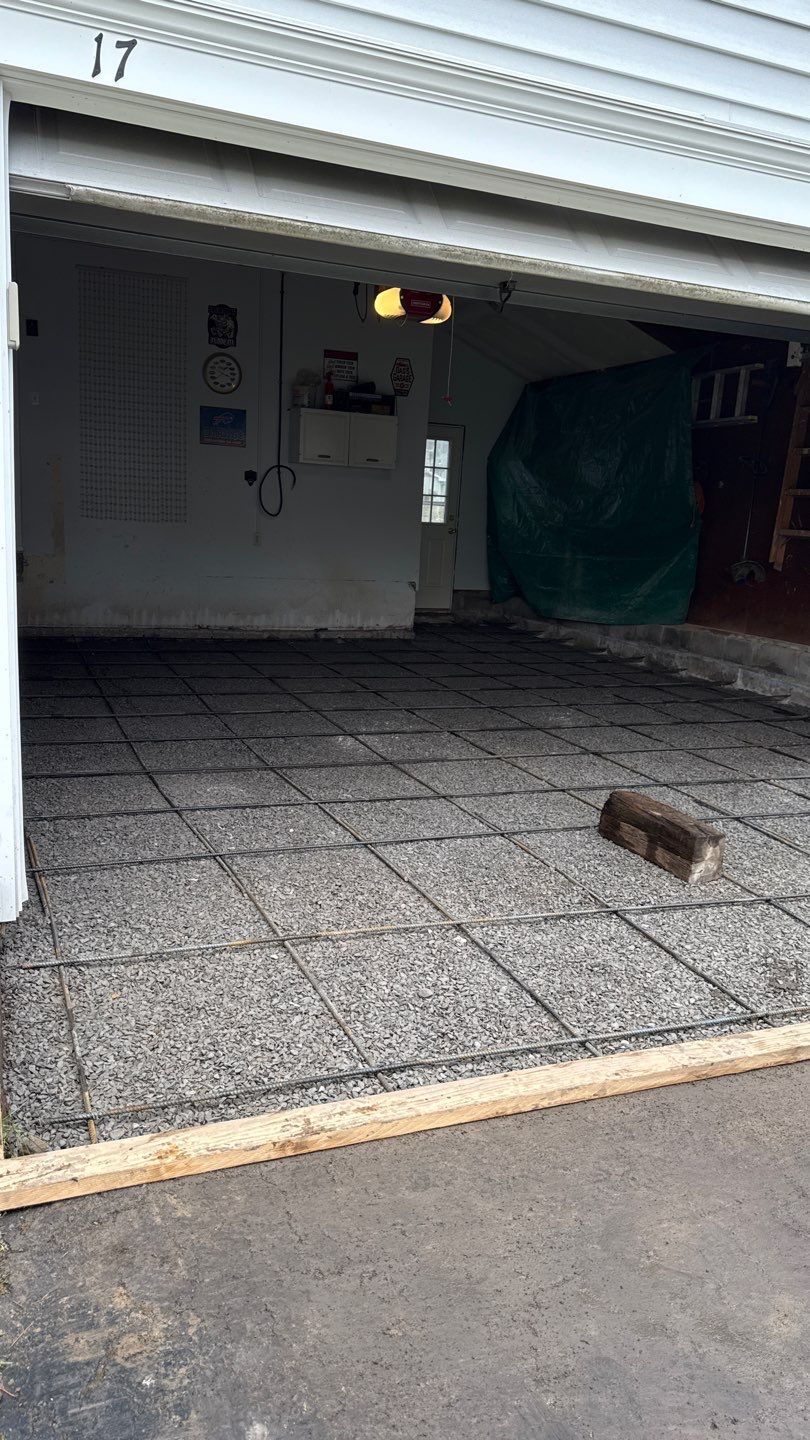 Concrete garage floor replacement  by NG Masonry & Construction LLC