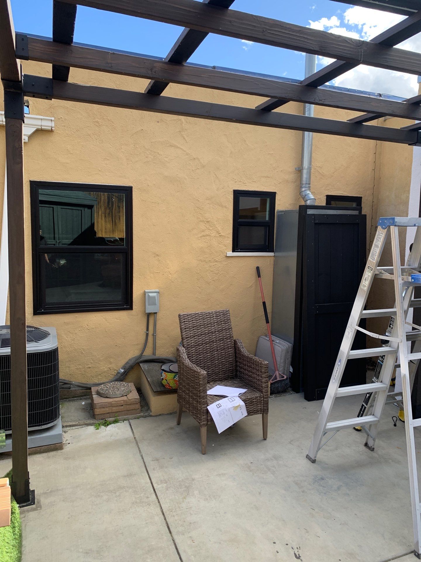 Window Installation using Black Anlin windows by American Window Company