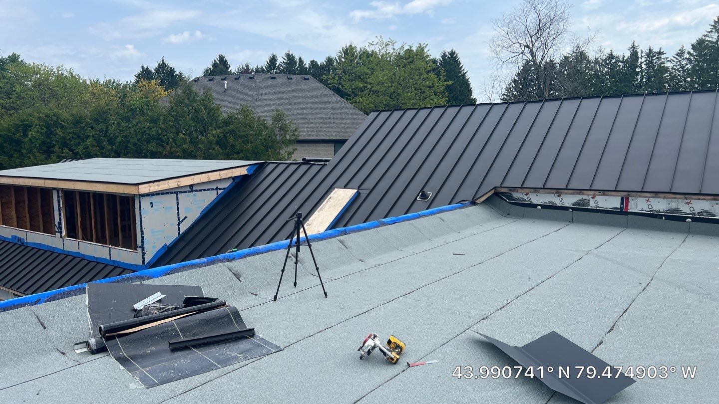 Custom Home Jet Black 24 GA Standing Seam Roof  by Jay Carter Roofing & Sheet Metal