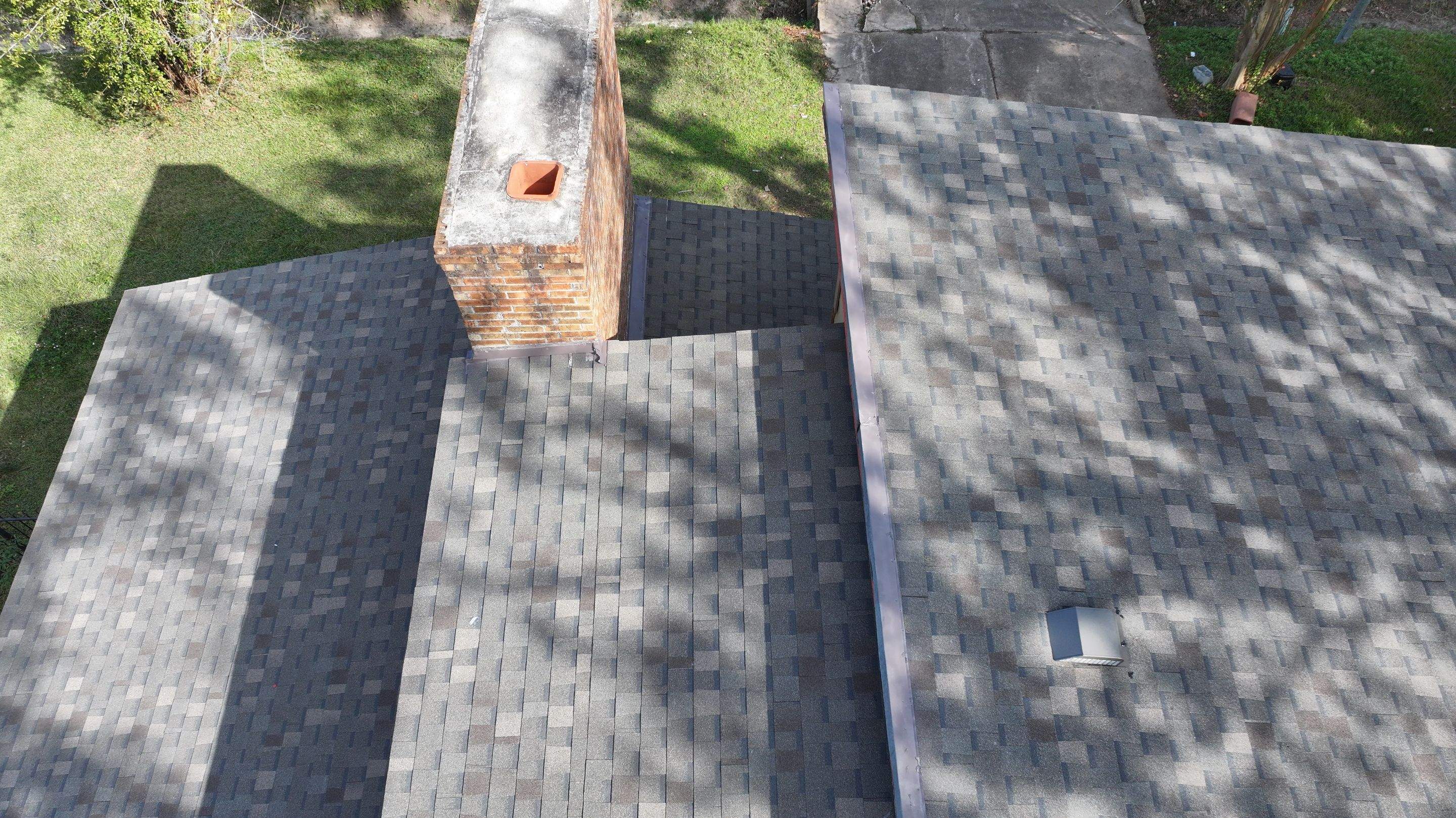 Roof Replacement with Chimney Flashing Detail — Houston, TX by PL Roofing & SB Roofing, LLC.