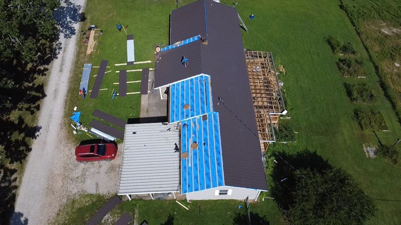 Residential Roof + Gutters & Downspouts & Gutter Covers Install  by Titan Commercial & Residential Roofing 