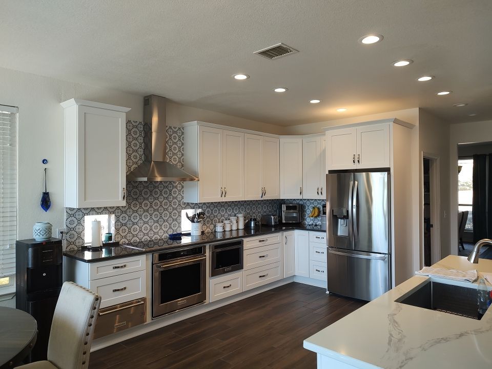 Stone Oak San Antonio Kitchen Remodel Featuring Custom White Cabinetry & Expanded Island by Legacy Bath and Kitchen 