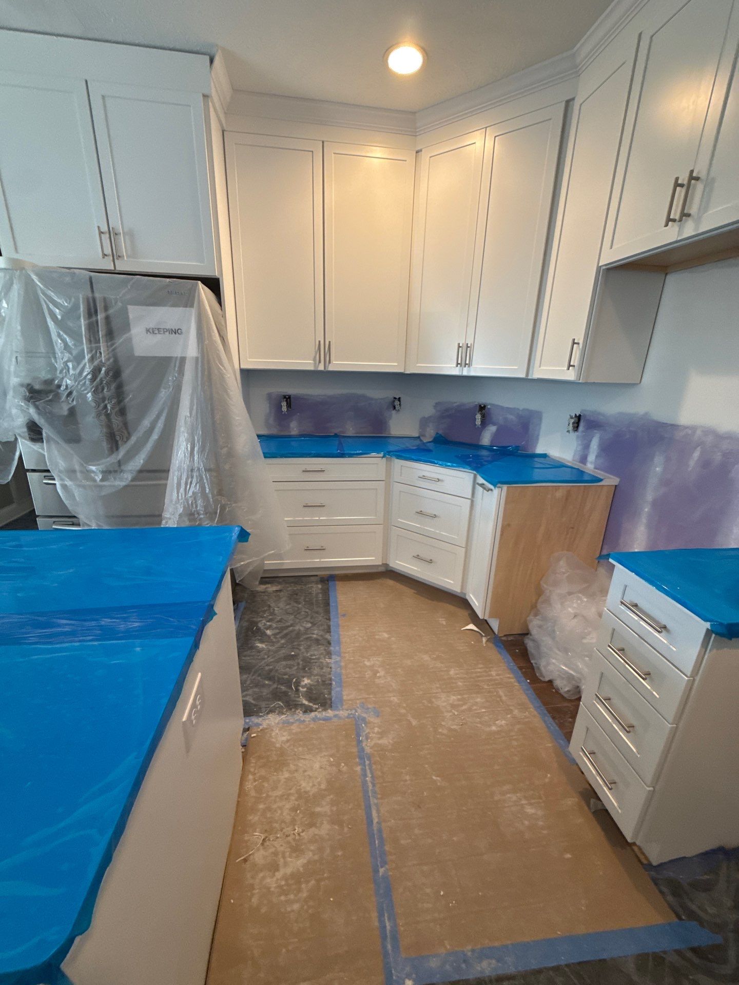 Complete Kitchen Renovation Featuring White Shaker Cabinetry in Fayetteville by Karcher Roofing & Construction