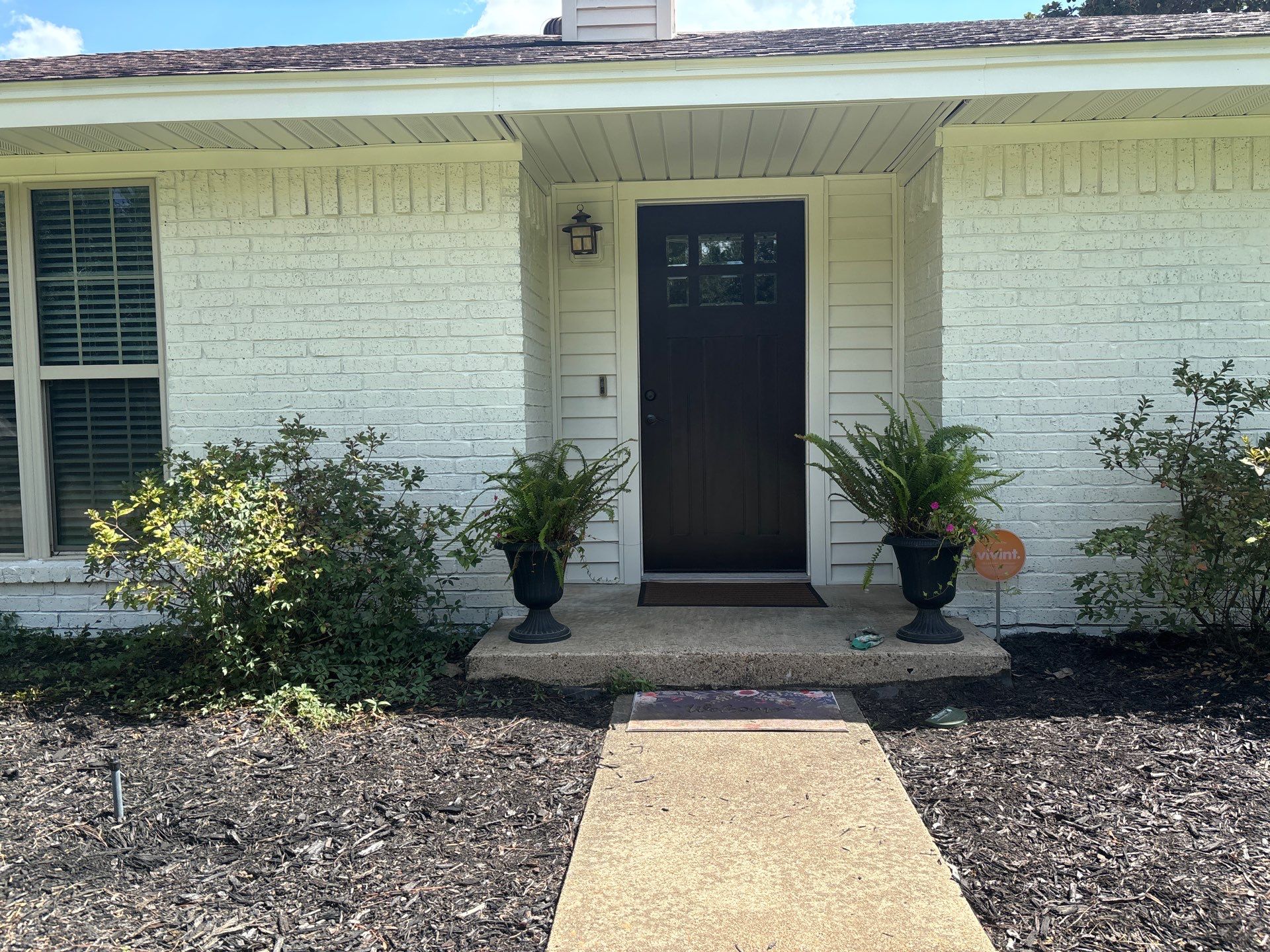 Exterior Painting in Flint, TX | White Brick Home & Metal Building with Sherwin-Williams Duration by Quality Coats Painting