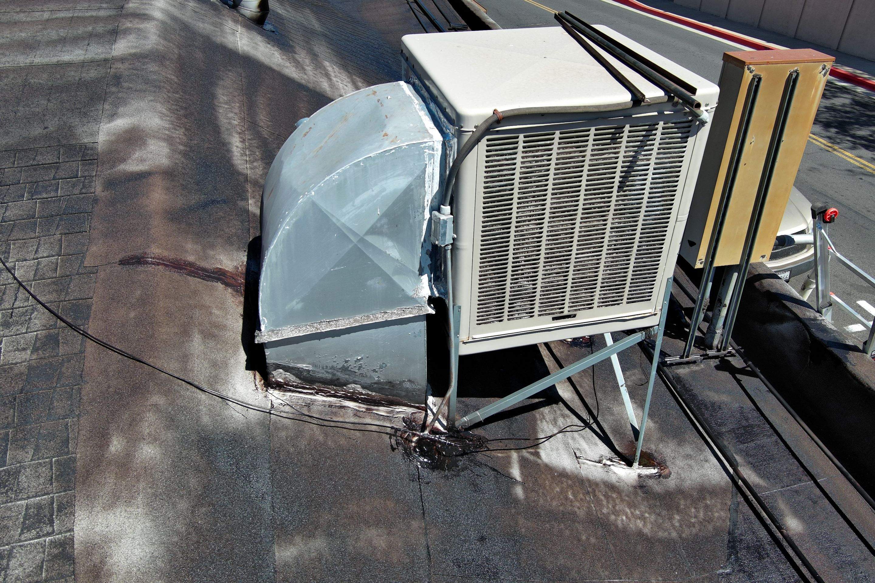 Foam and coatings on commercial roof by Straight Edge Roofing Inc