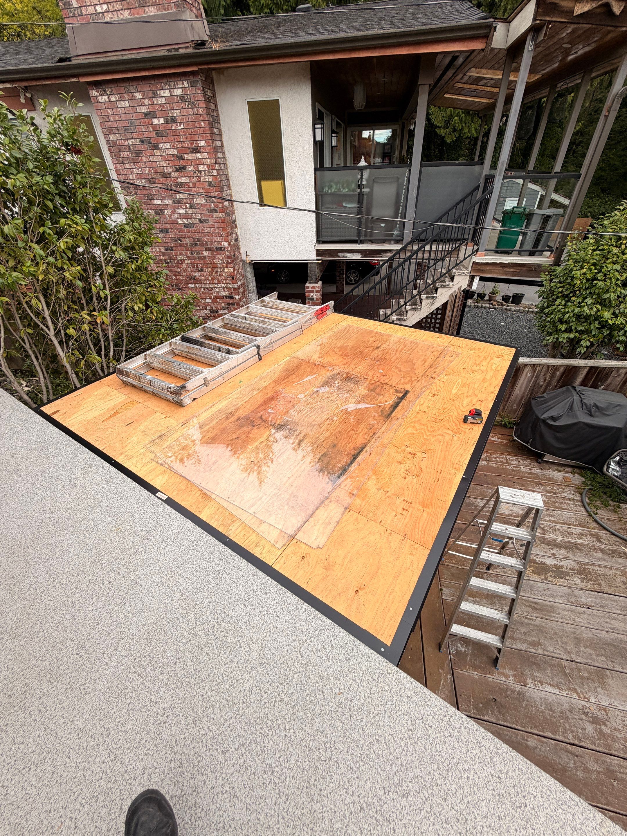 New Composite Deck with glass railing in North Vancouver by YVR Construction Group