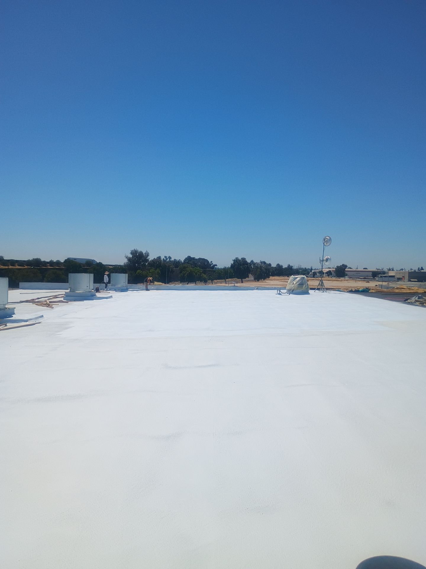 Pro Farms Spray foam roofing project by Straight Edge Roofing Inc