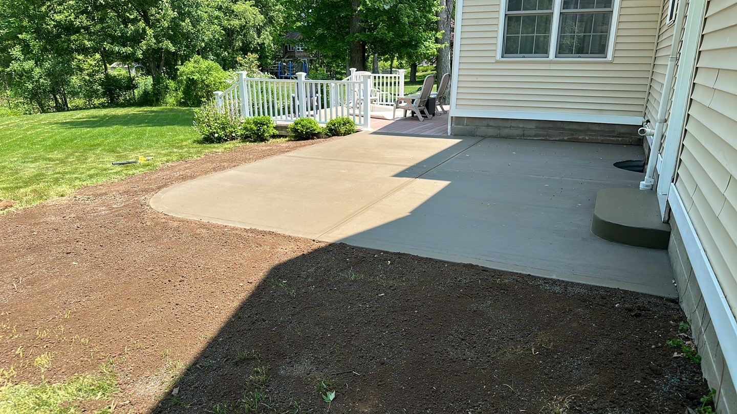 Broom finished concrete patio  by NG Masonry & Construction LLC
