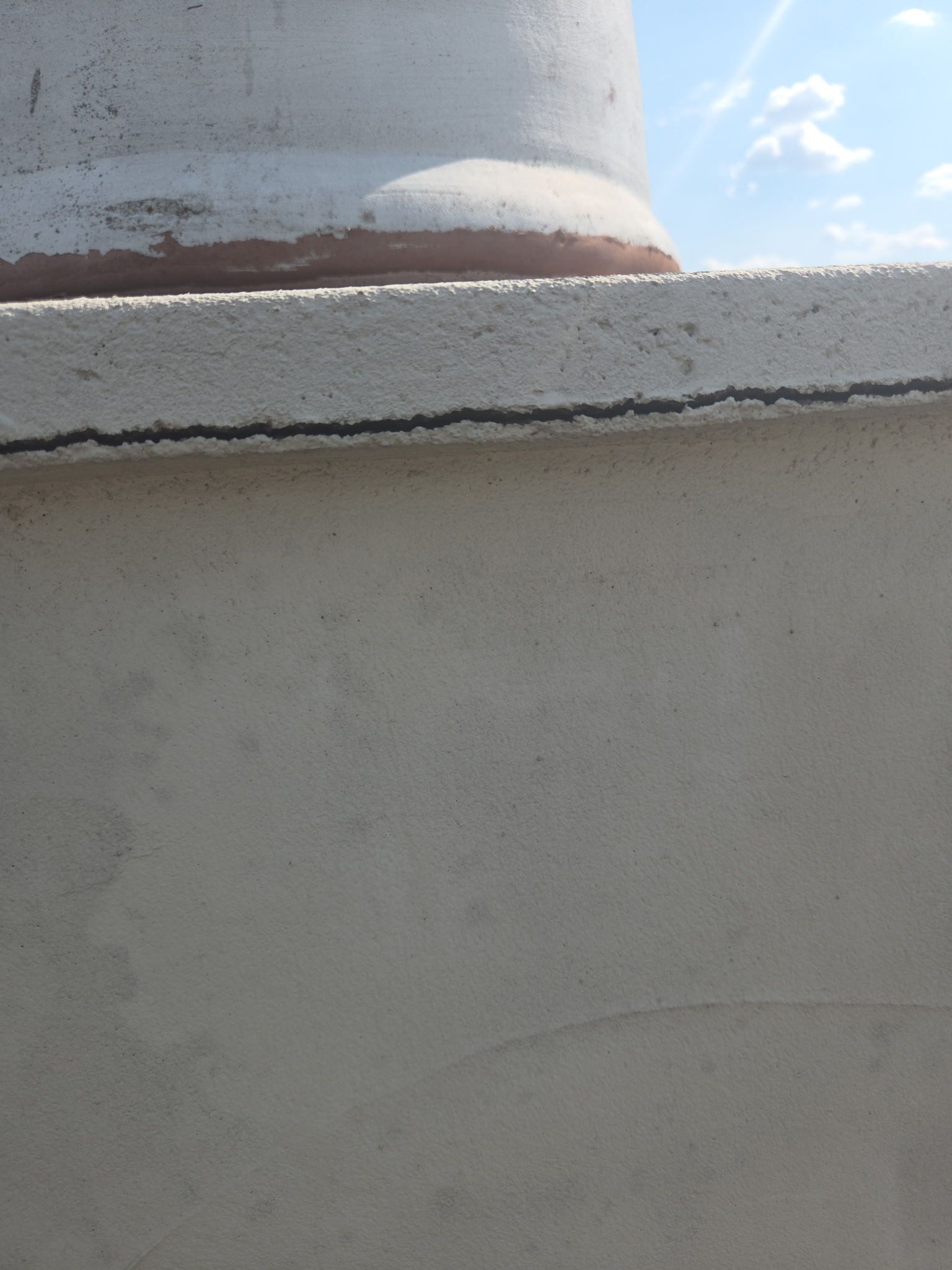 Tile roof and custom chimney cap by REPS Austin Area Roofer