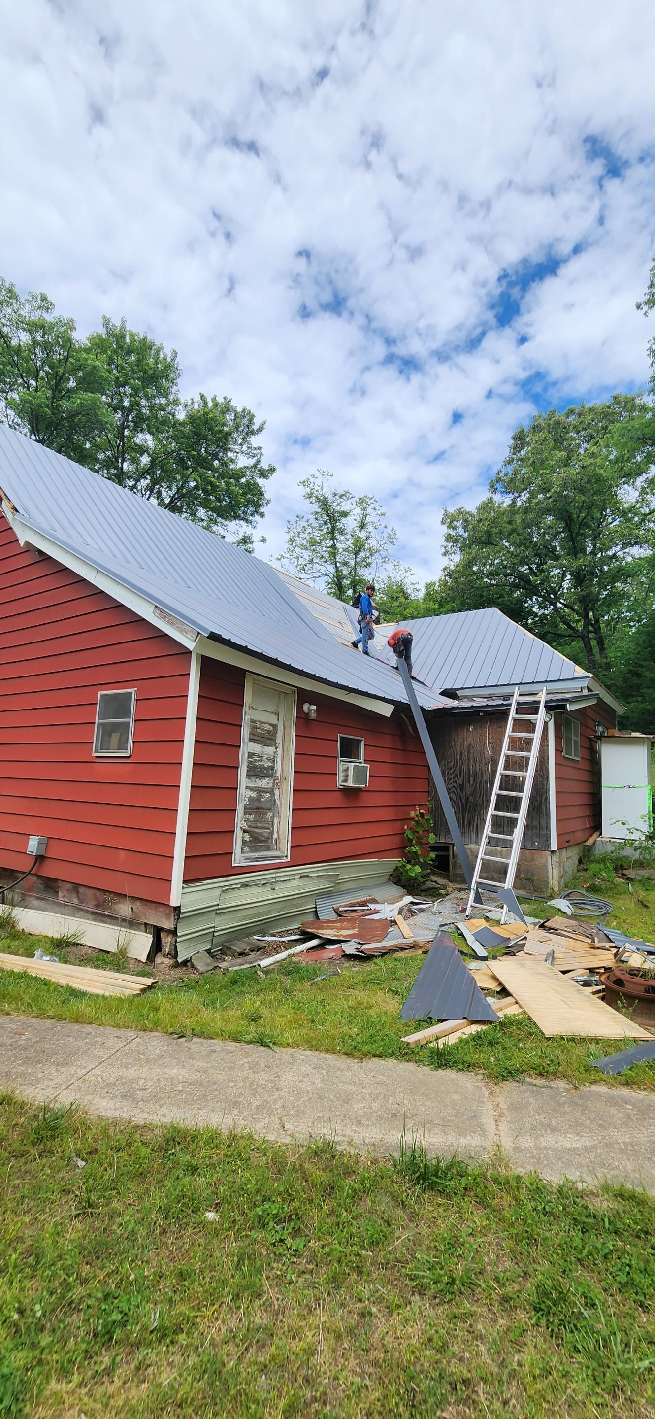 Residential Roofing Installation using 26 Gauge Colored Panels by Hostetler Roofing