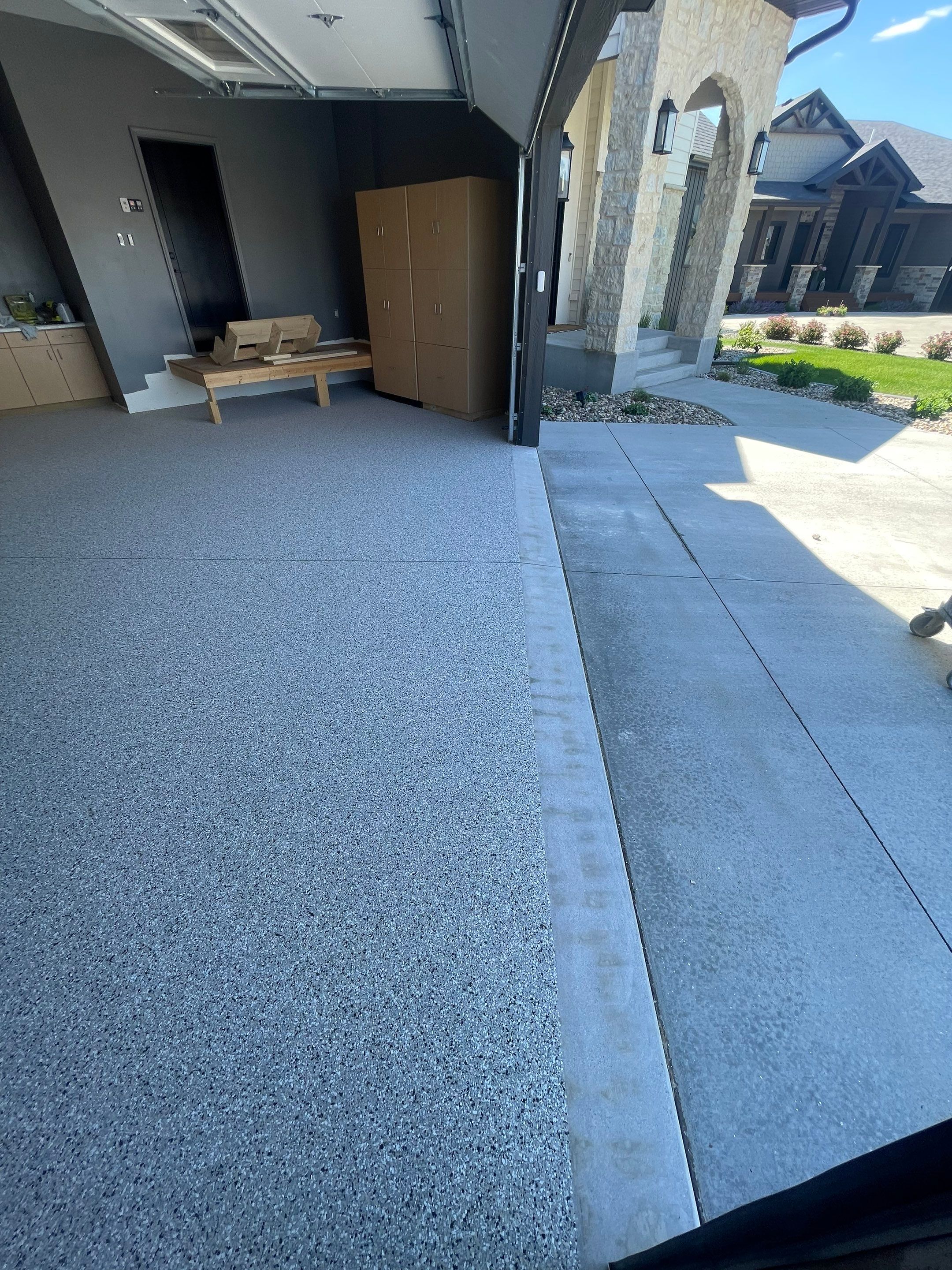 Custom Speckled Concrete Coating for Dell Rapids Garage by Select Painting, Coatings & Garage Cabinets