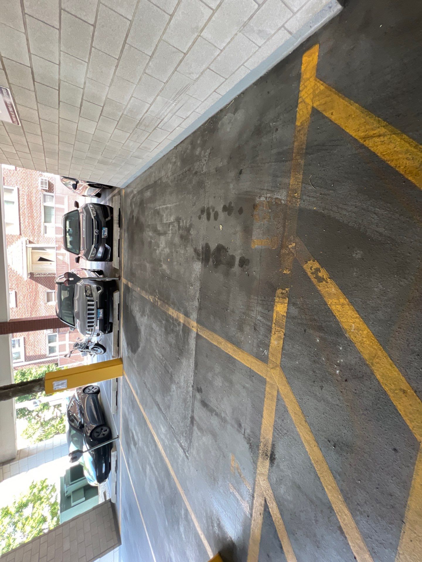 Parking garage using Hot water by Northern Power Washing LLC.