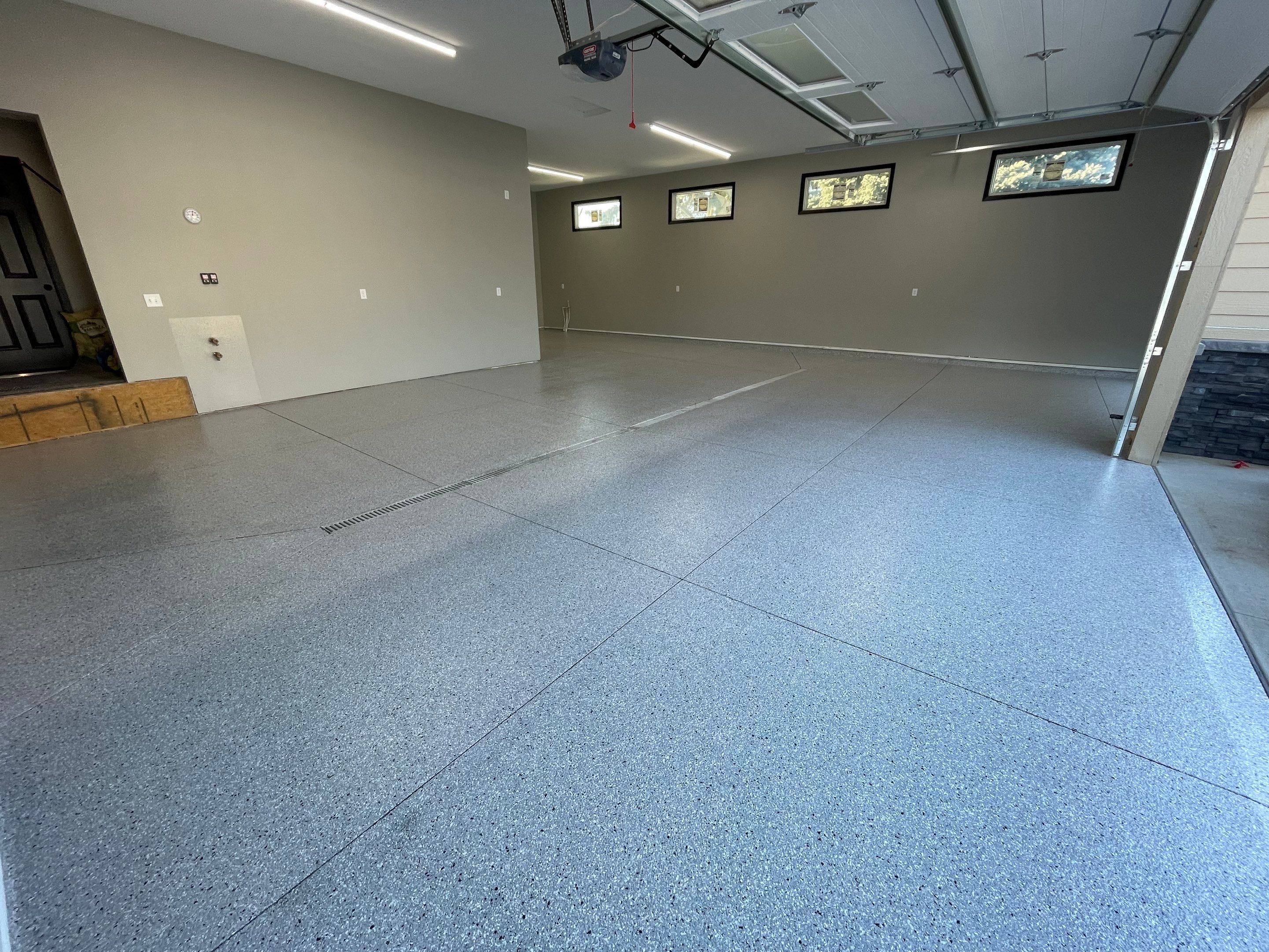 Decorative Flake Concrete Coating Installation in North Sioux City by Select Painting, Coatings & Garage Cabinets