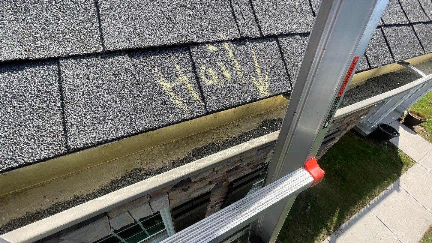 Roof Damage using Certainteed Lifetime Roofing System- Moire Black Landmark Pro shingkes with shadow ridge caps. by BulletpROOF Exteriors
