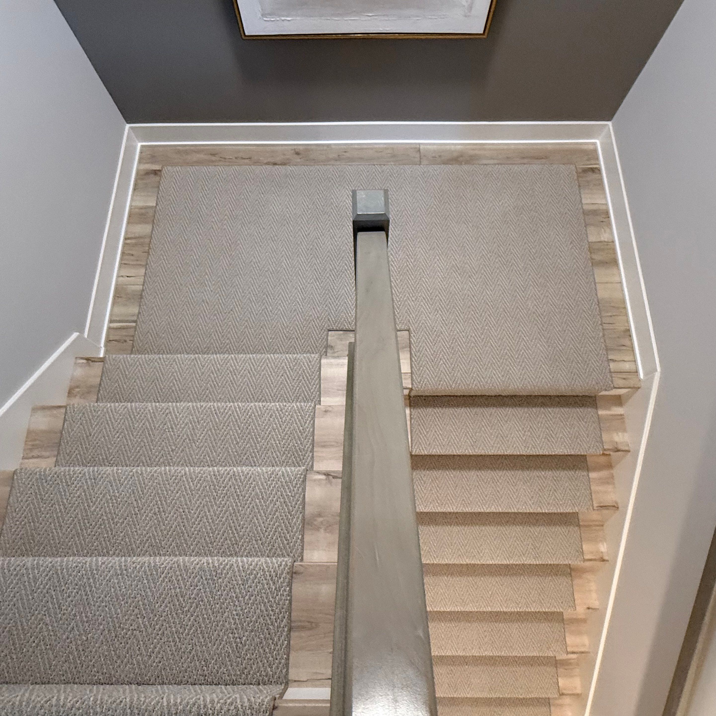 Fishers Staircase Renovation Featuring Custom Herringbone Runner and Modern Railing by Brothers Floor Covering INC.