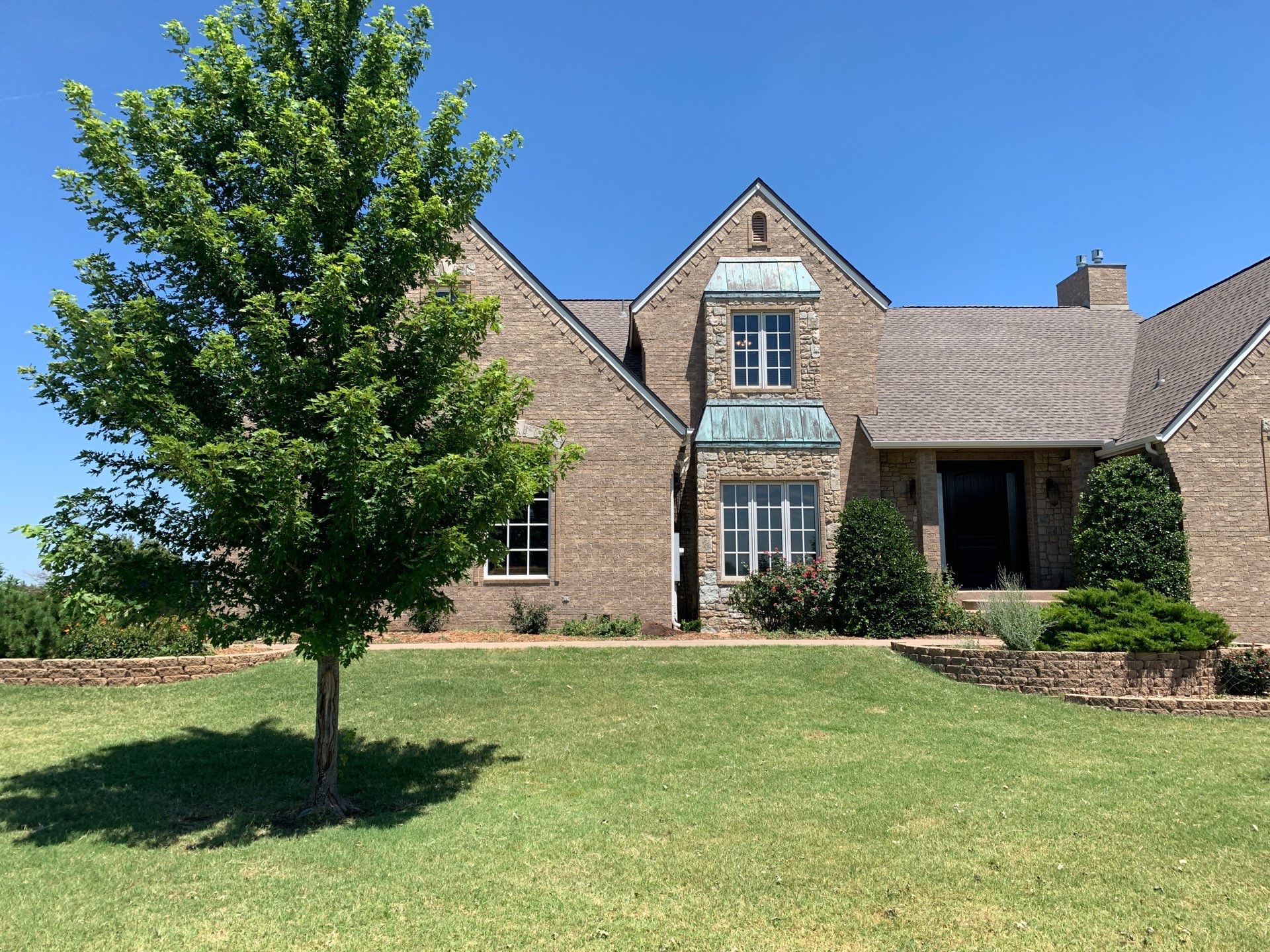 Roof Replacement and Gutter Installation in Edmond, OK by McCann's Roofing and Construction