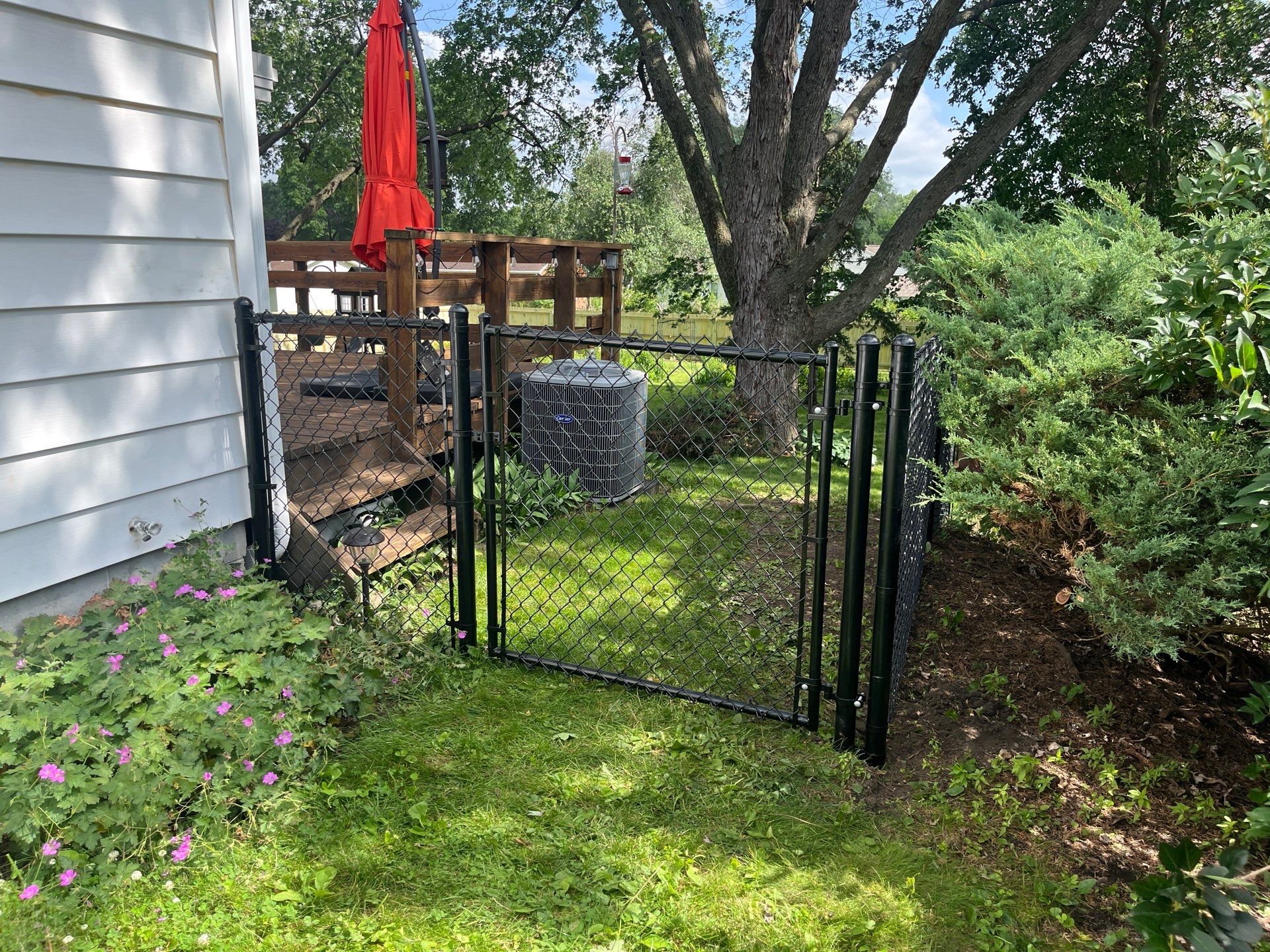 Custom Treated Pine Privacy Fence and Chain Link Installation in Cedar Falls by Perfect Picket Fence and Stain