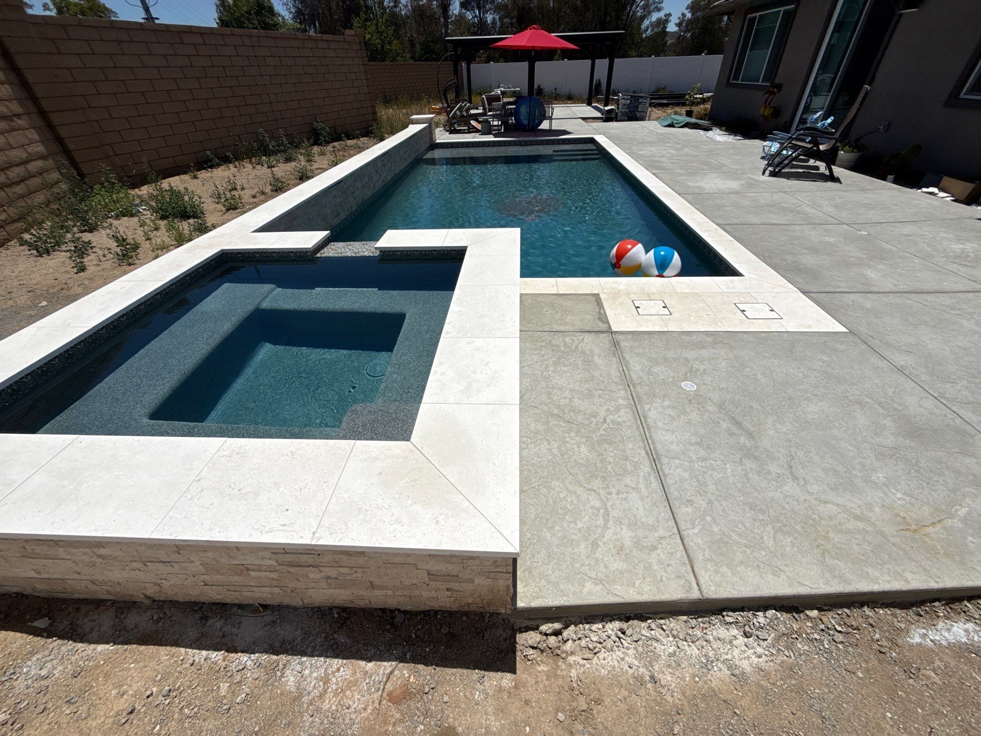 Clean lines with this pool and spa by Premier Pools and Spas Temecula