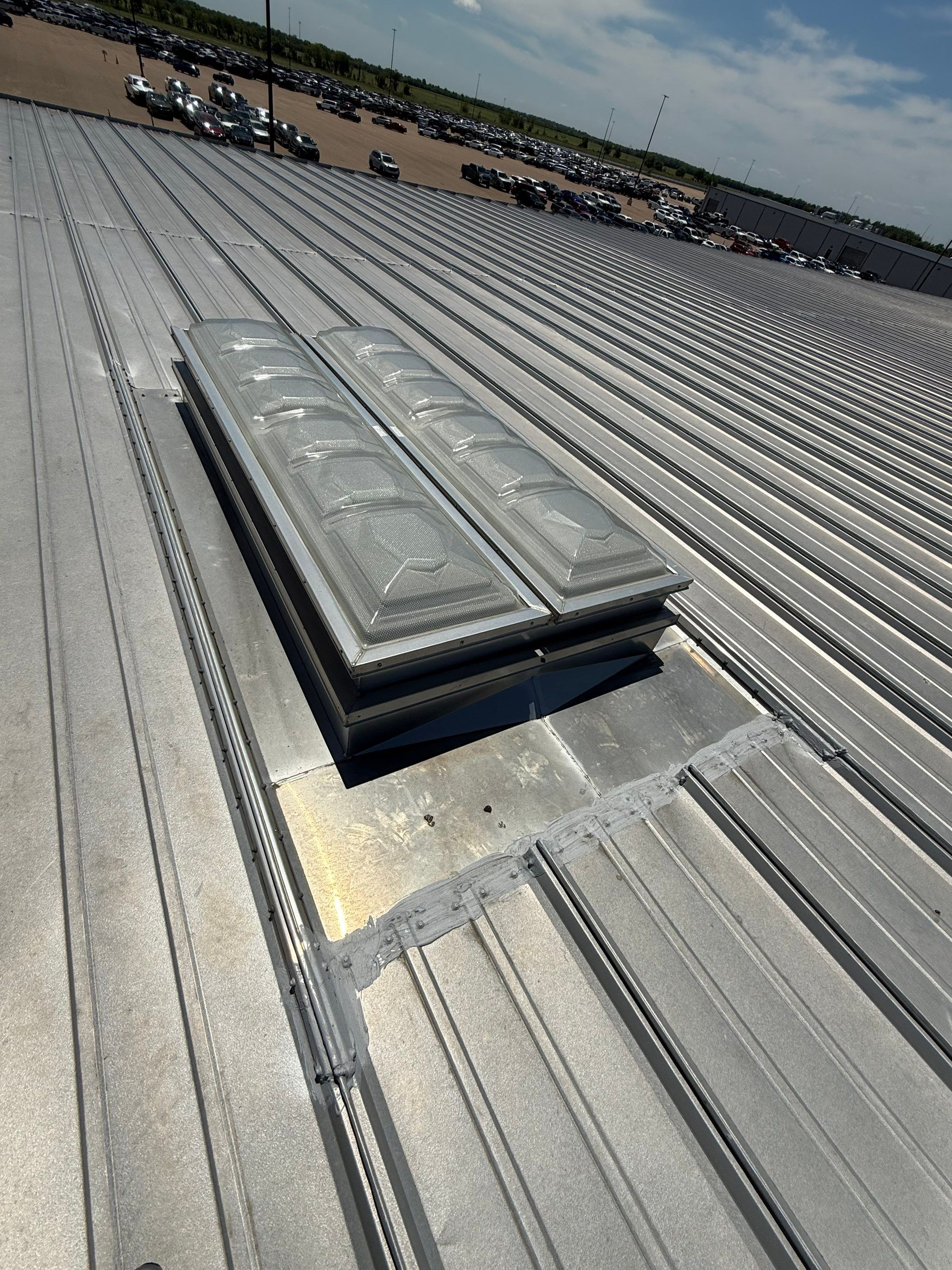 Commercial Metal Roof Repair and Skylight Sealing in West Memphis by Revival Roofing Services