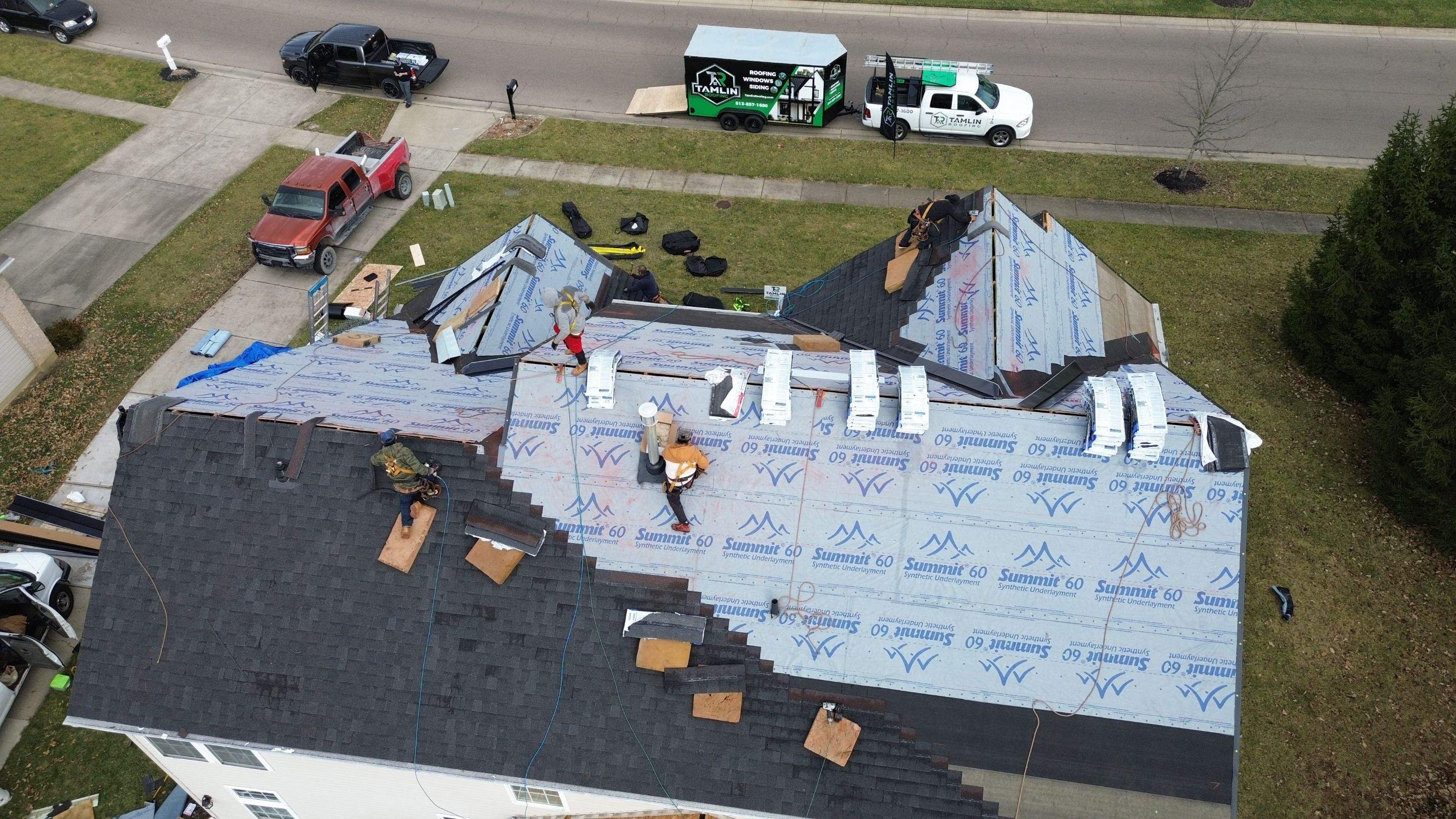 Walden Ponds - Pristine Black and Hydro Flo Gutter Guards by Tamlin Roofing