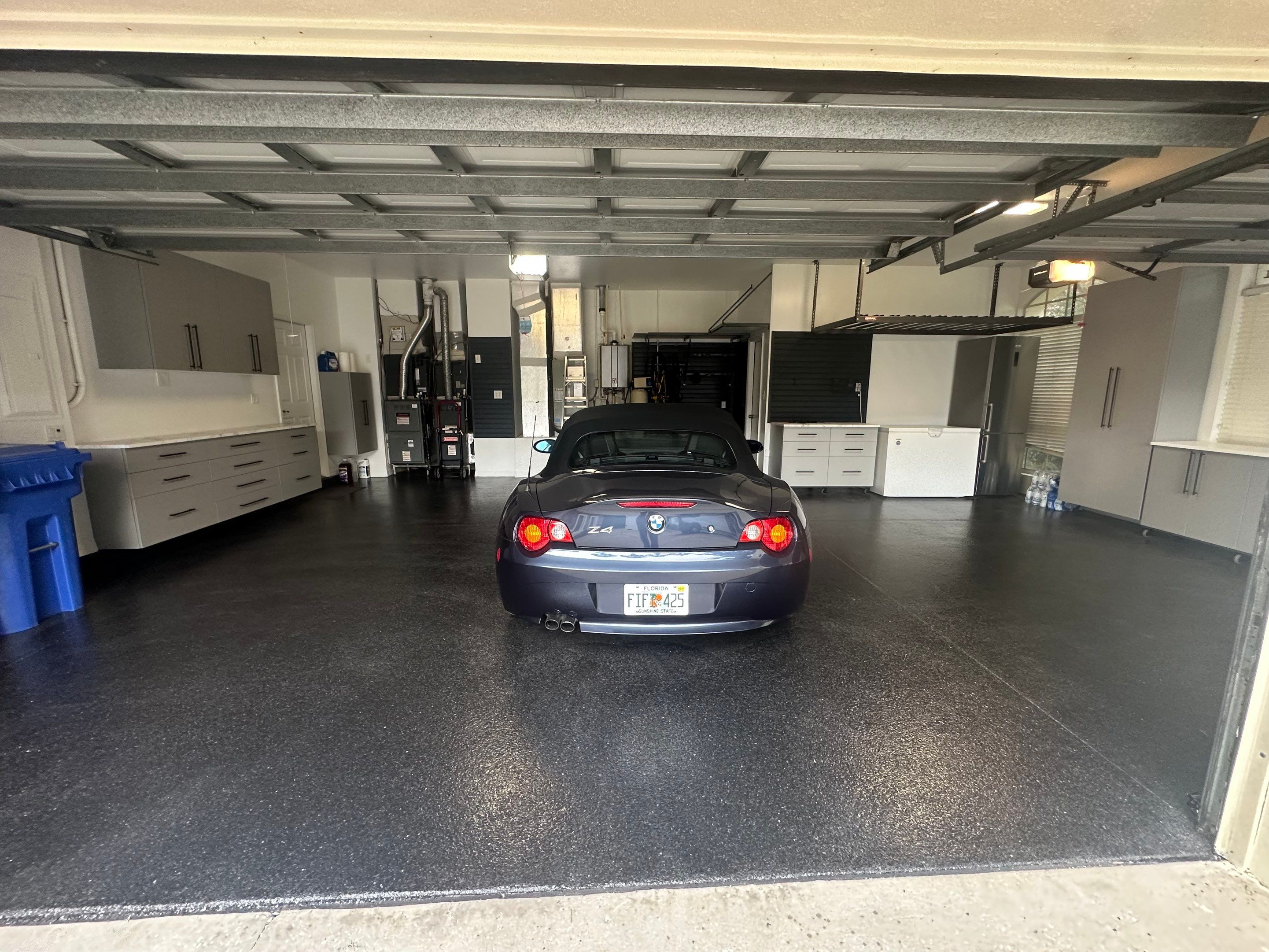 Tampa Garage Floor Coating and Overhead Storage Rack Installation by Square 1 Garage and Closet Solutions