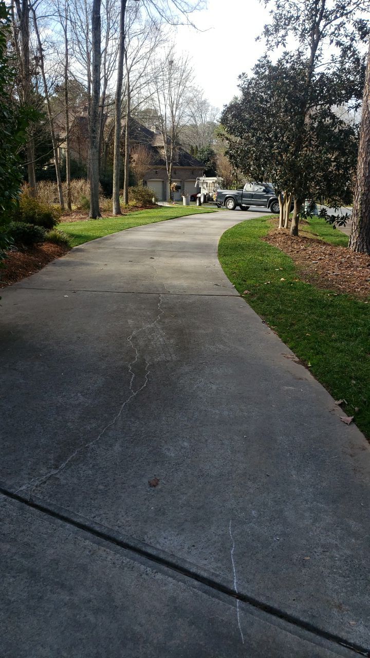 Driveway Clean using cleaner by Power Wash Masters LLC